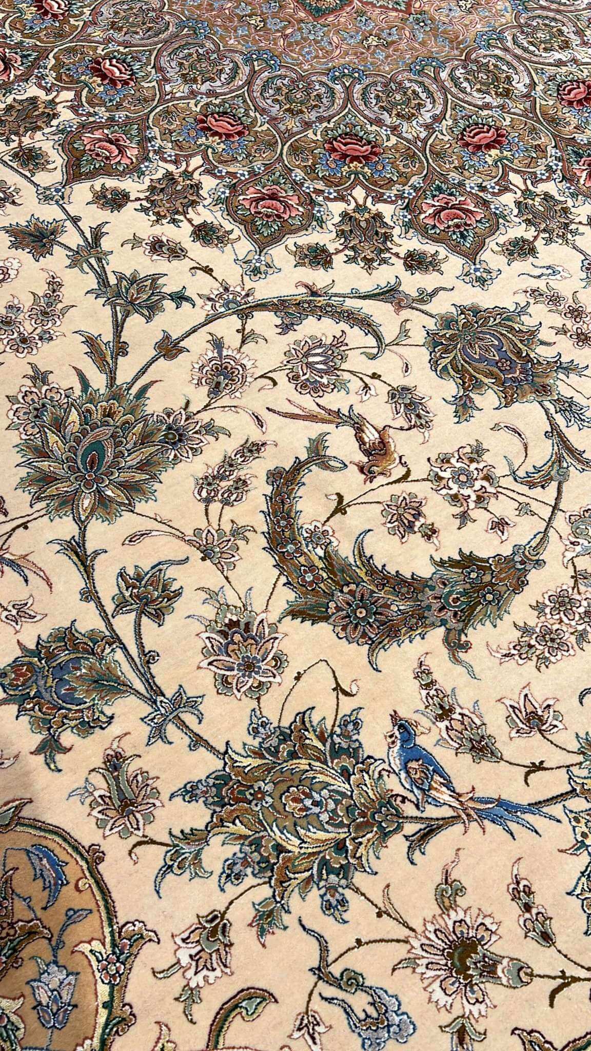 "Exquisite 13x10 feet Persian rug from Isfahan, hand-knotted with silk floral patterns, ideal for living rooms and formal spaces."
