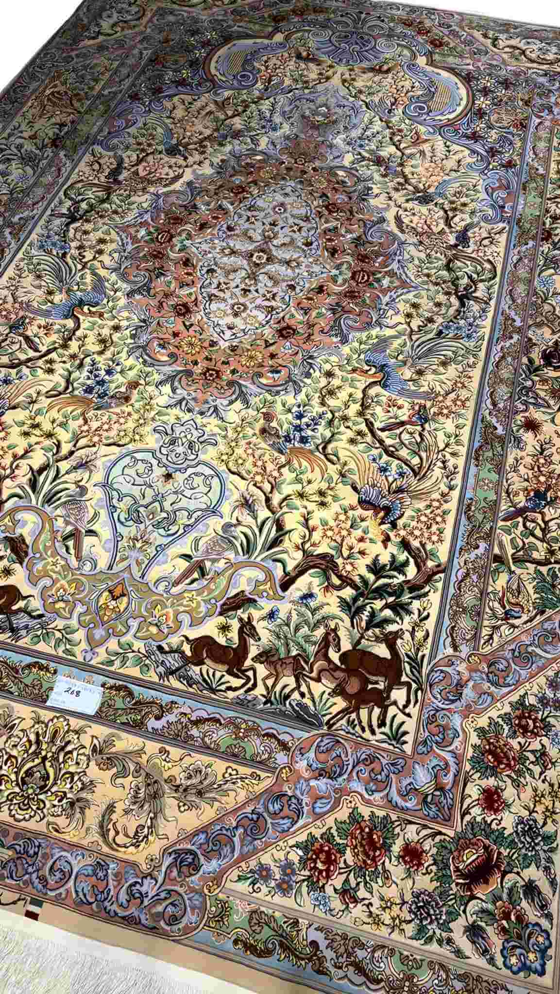 "Masterfully crafted Isfahan silk rug by Mehdie Saberie, showcasing vibrant colors and Persian artistry."