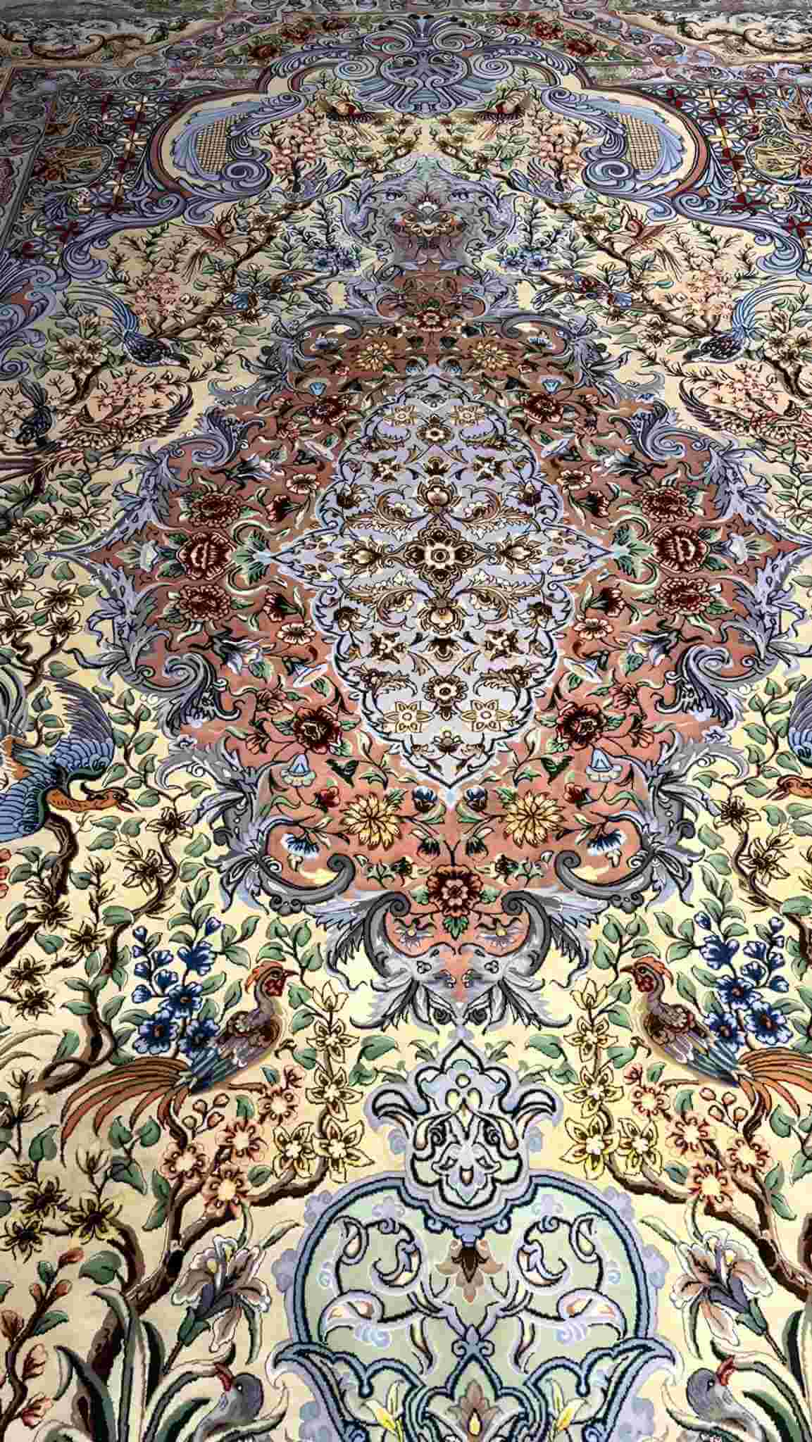 "Close-up of the detailed silk field floor on the hand-knotted Isfahan Persian rug."