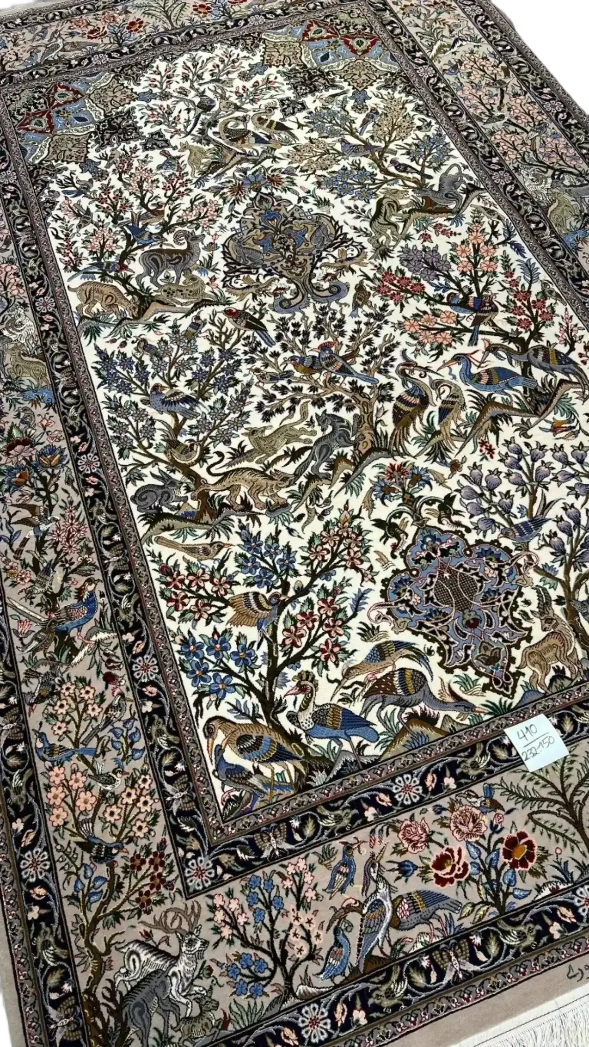 Luxurious silk and wool rug adorned with detailed floral designs