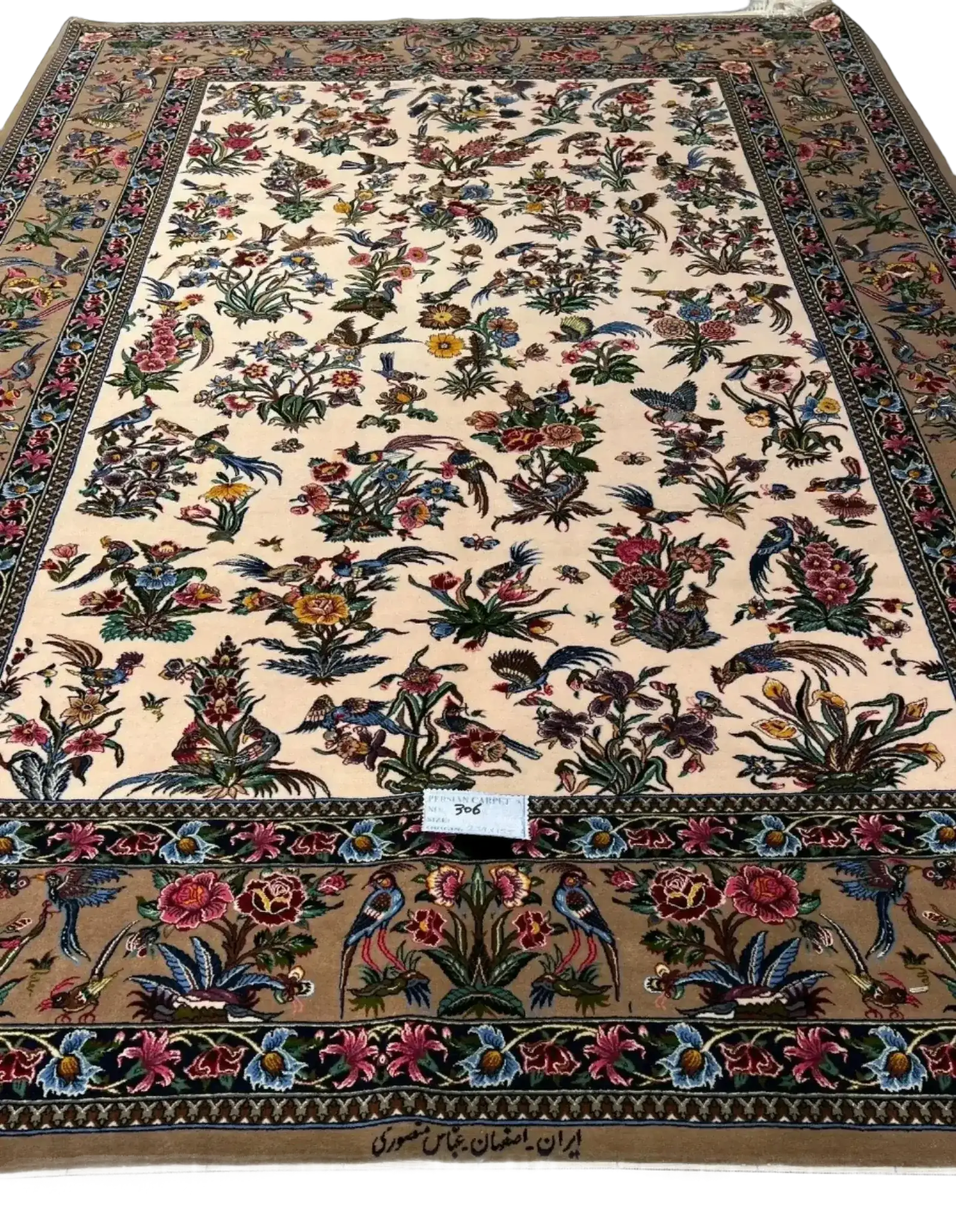 Close-up view of Mansourie's Legacy, showcasing the detailed floral patterns on the rare Persian carpet