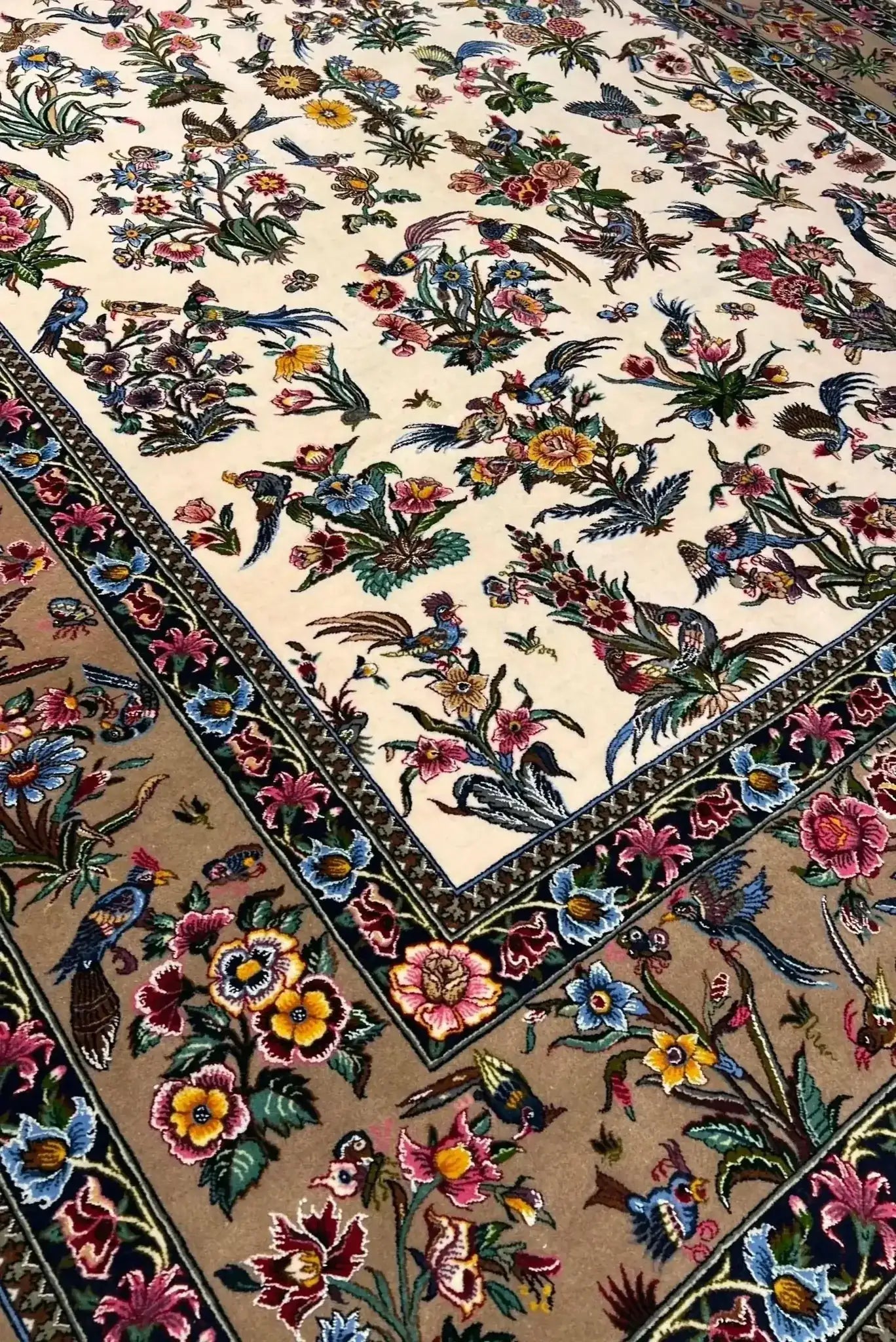 Mansourie's Legacy Persian carpet adorned with intricate floral and avian motifs