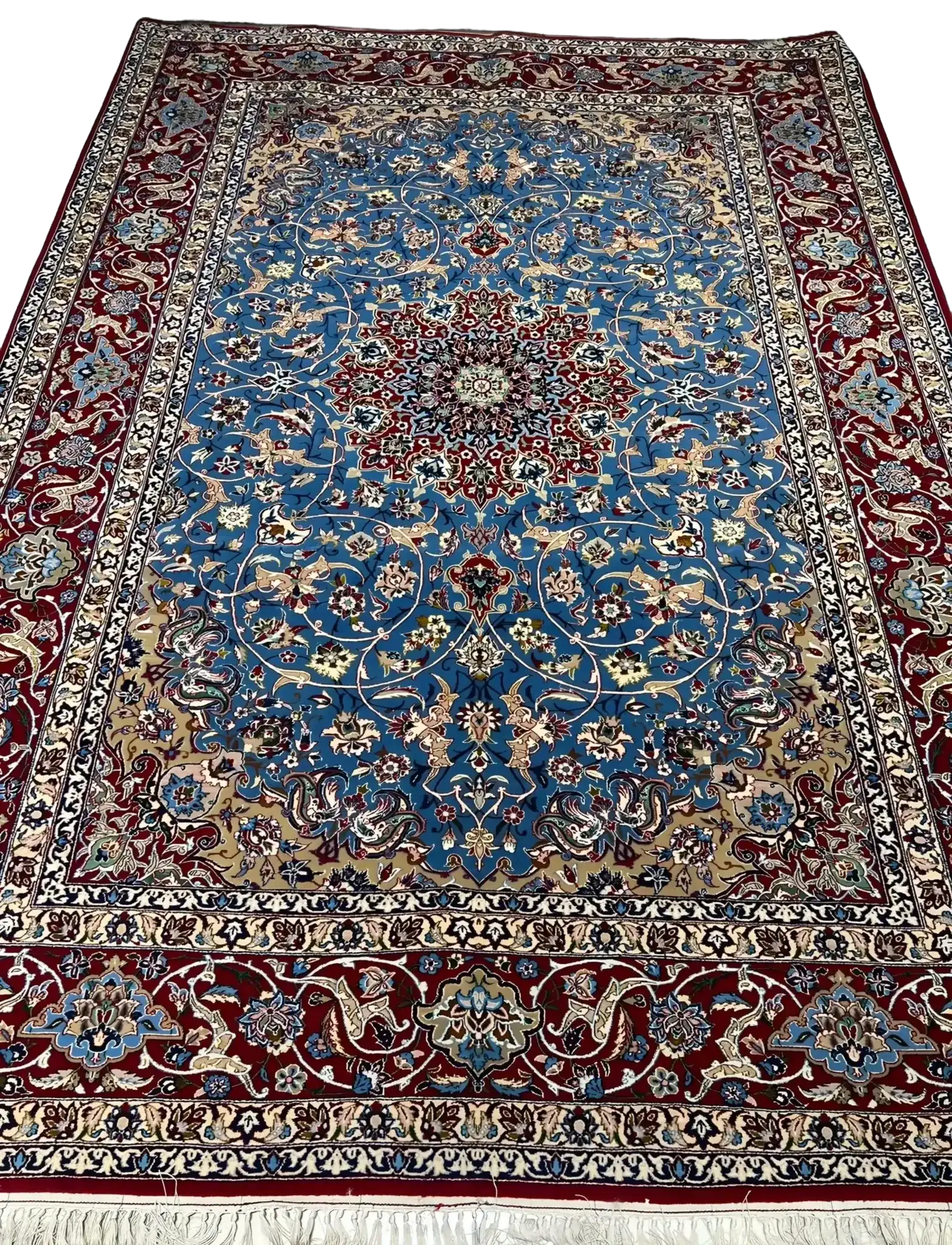 Detail shot of the hand-knotted craftsmanship of the Authentic Isfahan Rug with a focus on the blue and red design