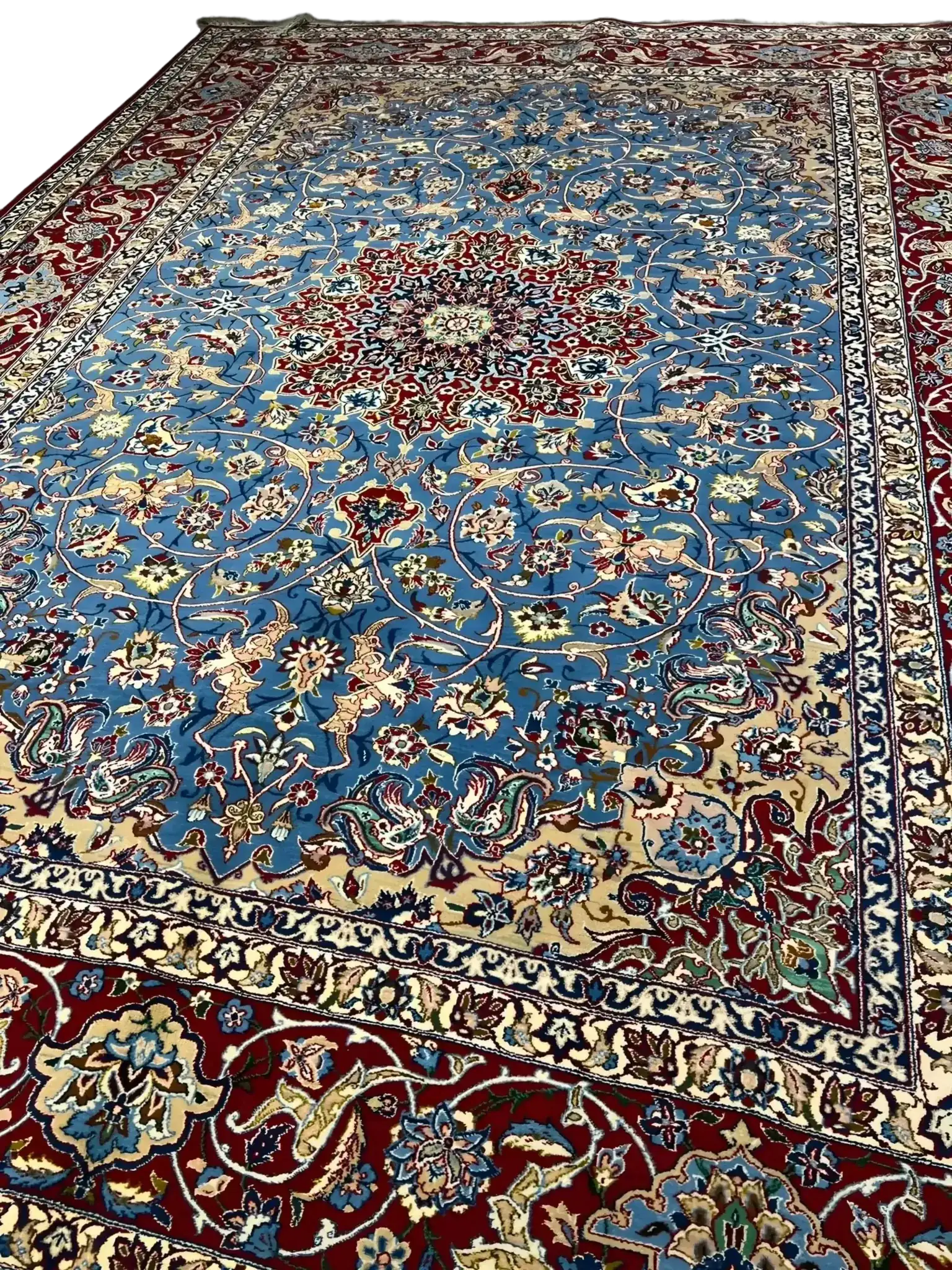 Close-up view of the intricate patterns on the Authentic Isfahan Rug with blue and red hues