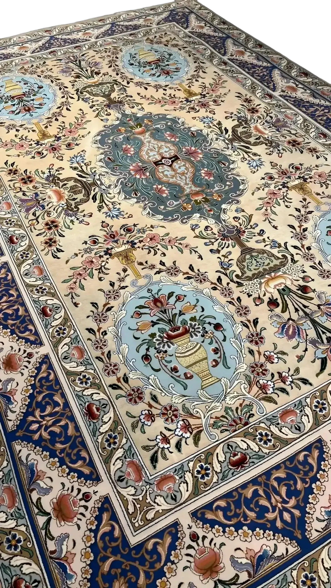 Close-up of the fine weave and detailed design on an Iranian silk rug