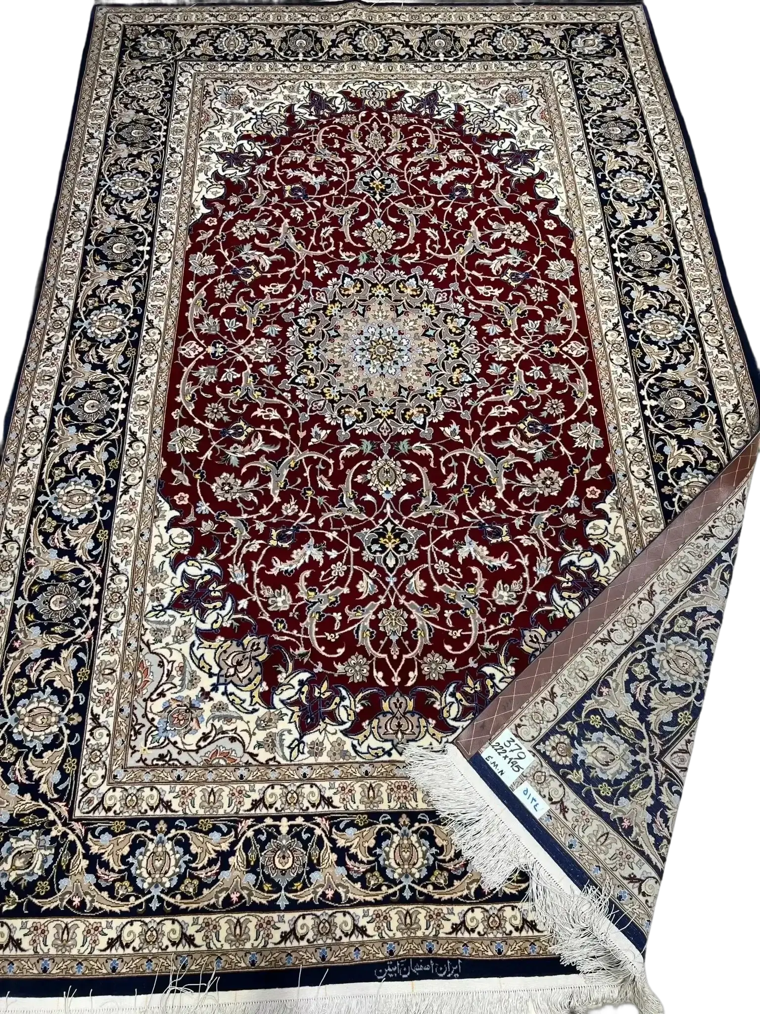 Traditional Isfahan Persian rug showcasing its expansive design with red and blue hues