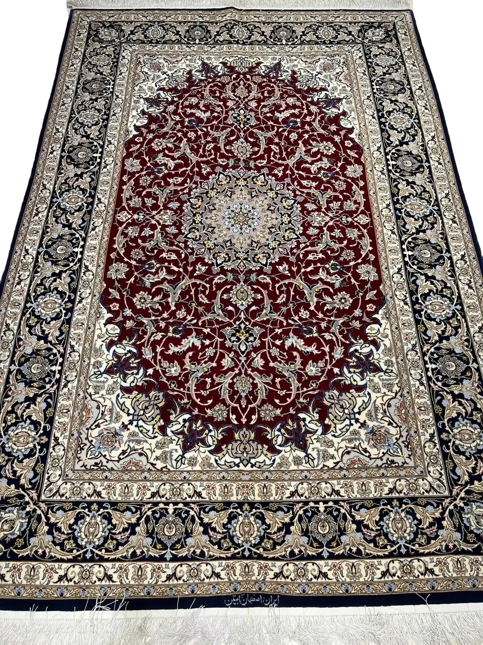 Close-up view of the intricate weave and color scheme on an Isfahan Persian rug