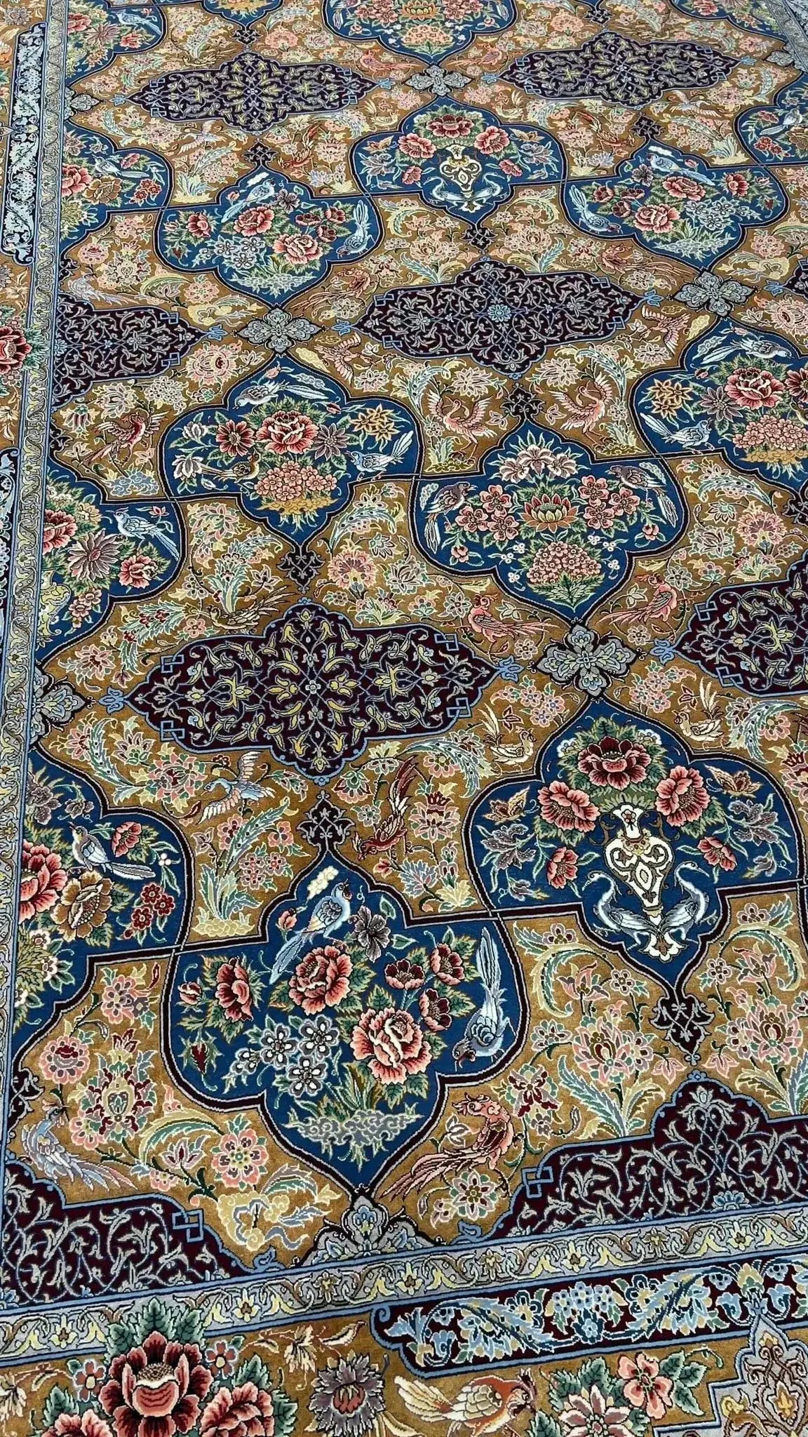 Isfahan Persian rug displaying vibrant colors and traditional design, featuring floral motifs and a high knot density.





