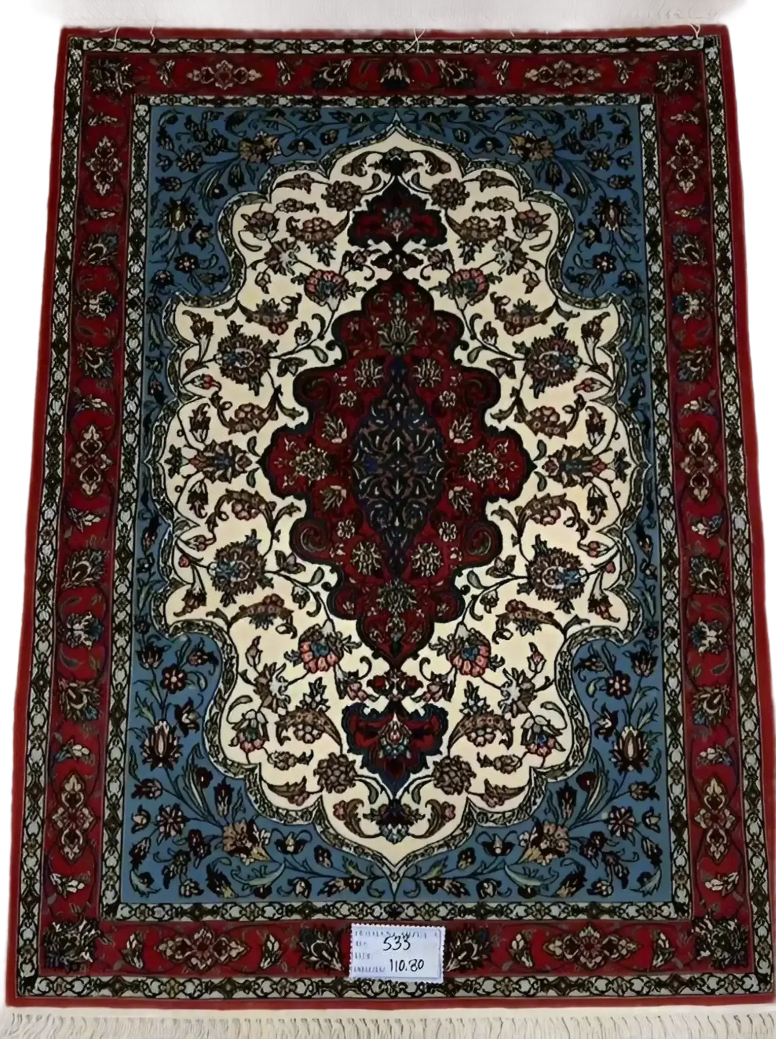 "Hand-knotted Isfahan Persian rug in vibrant red, blue, and ivory tones featuring intricate floral patterns, crafted from silk and wool for a luxurious addition to any home décor."






