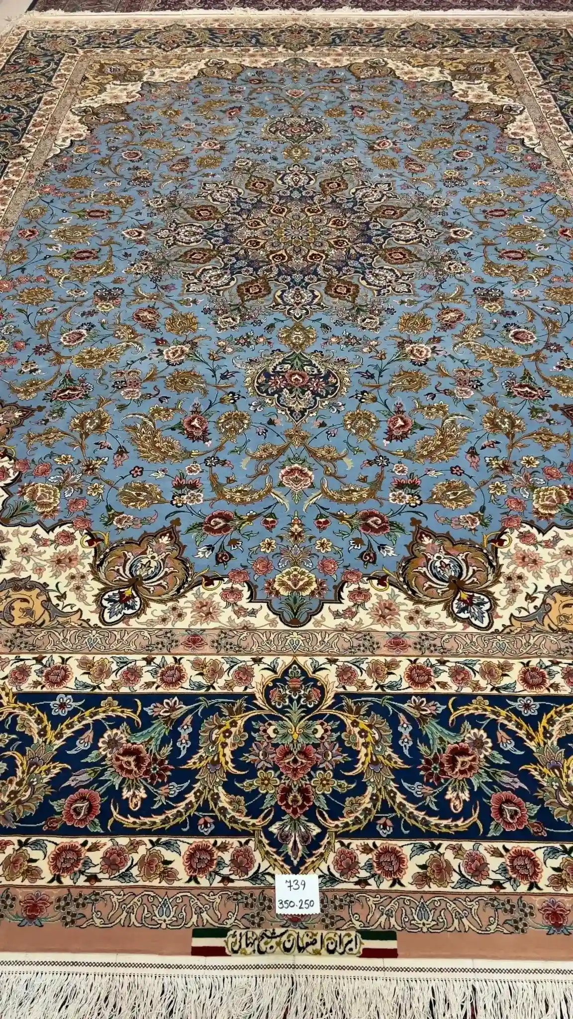 "Full view of the Sheikh Bahaie Isfahan Persian rug, showcasing rich blue tones and intricate border design."