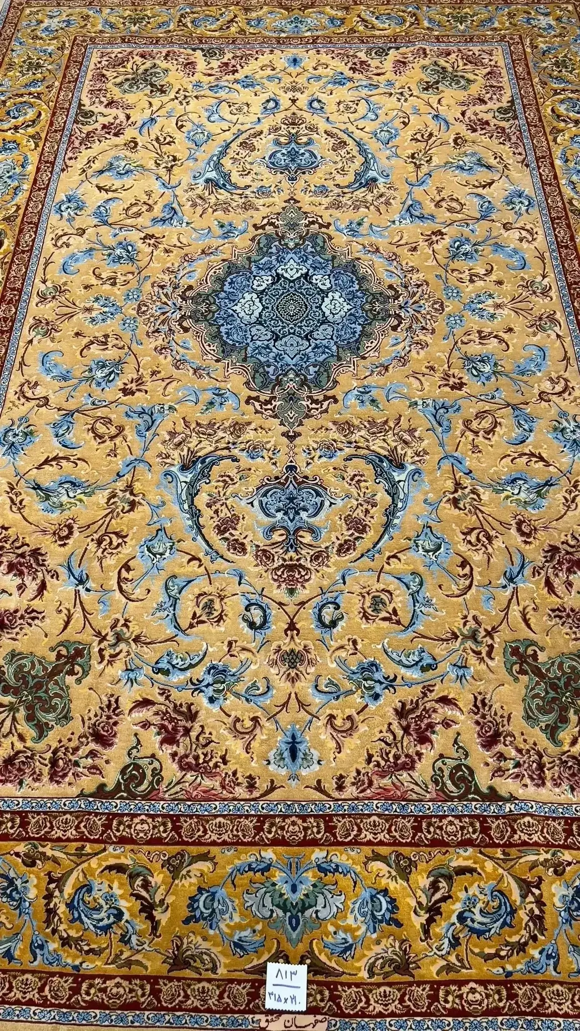 Mohaghegh's high-density silk carpet adorned with elaborate traditional designs