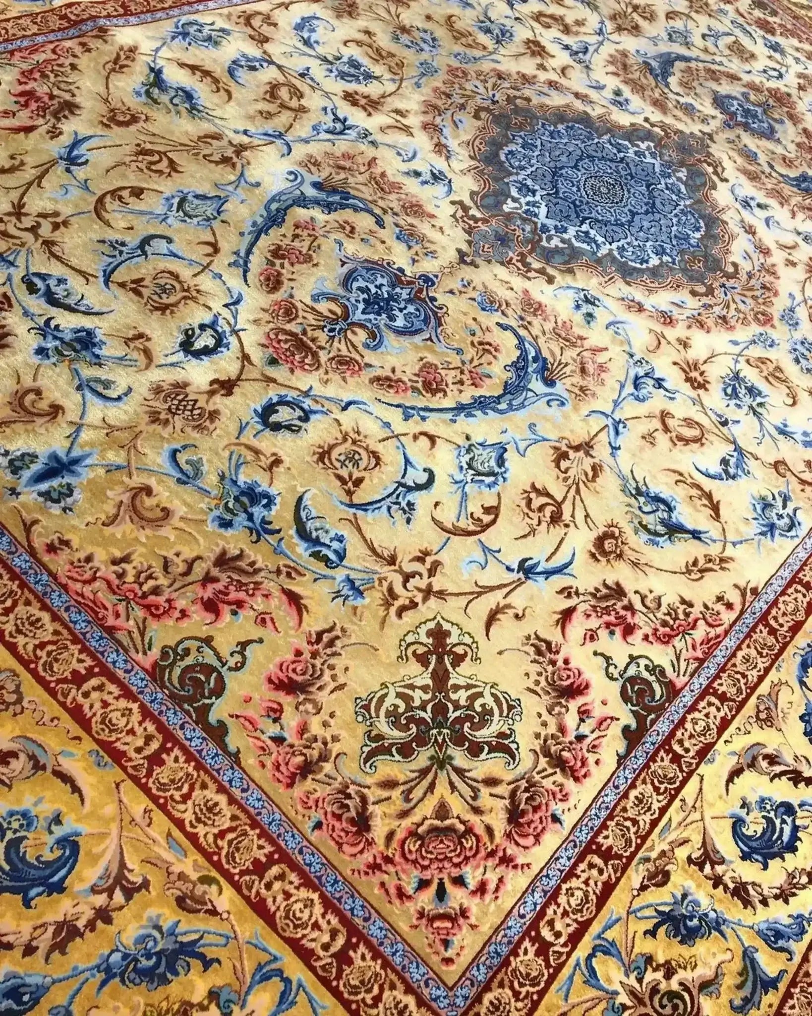 Exquisite Mohaghegh silk carpet with a rich blend of blue, red, and yellow hues