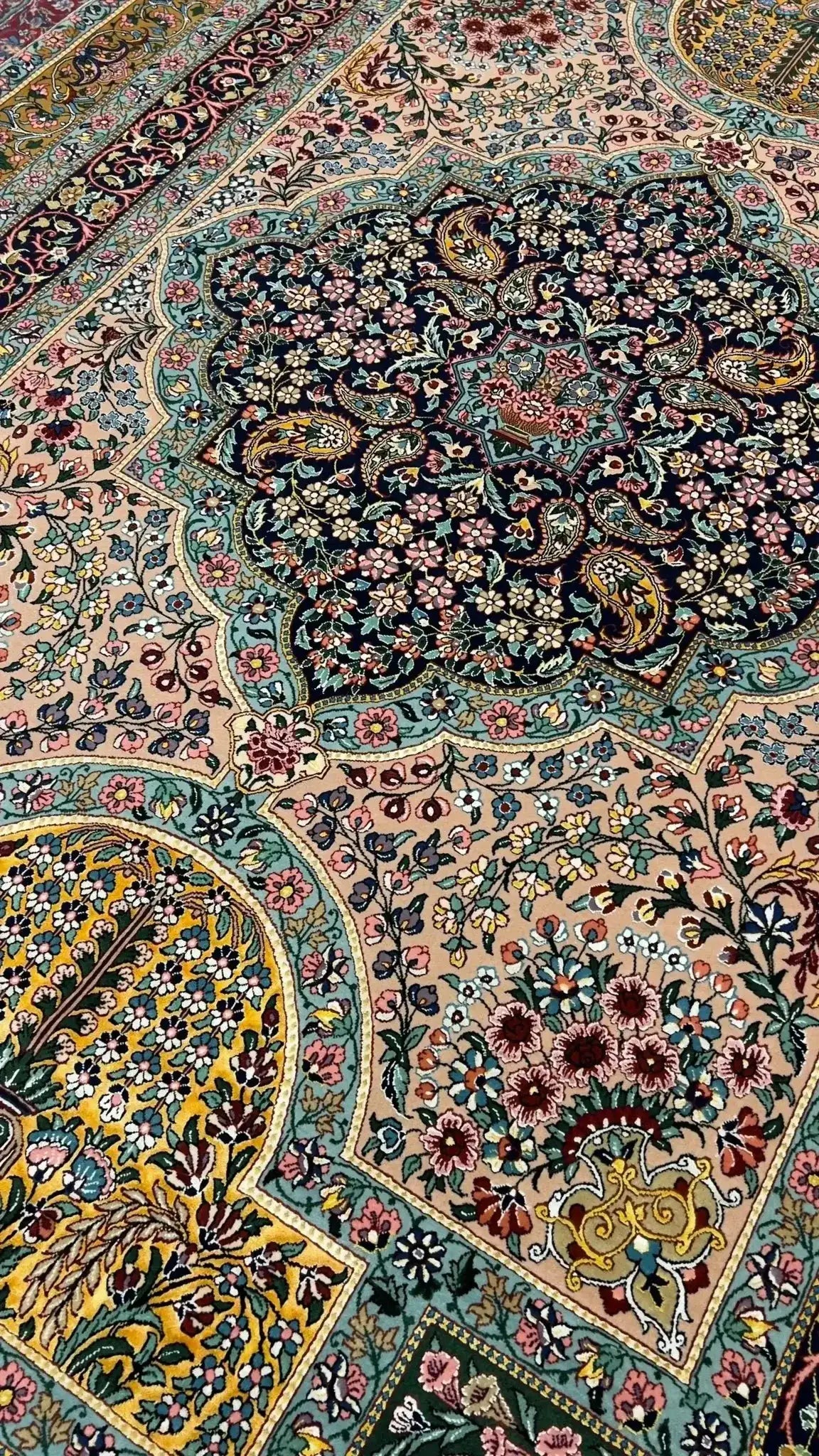 Close-up of Samavie Rug's Central Medallion – A close-up shot highlighting the exquisite central medallion of the Samavie Persian rug, featuring delicate floral designs in soft blues, pinks, and greens.

