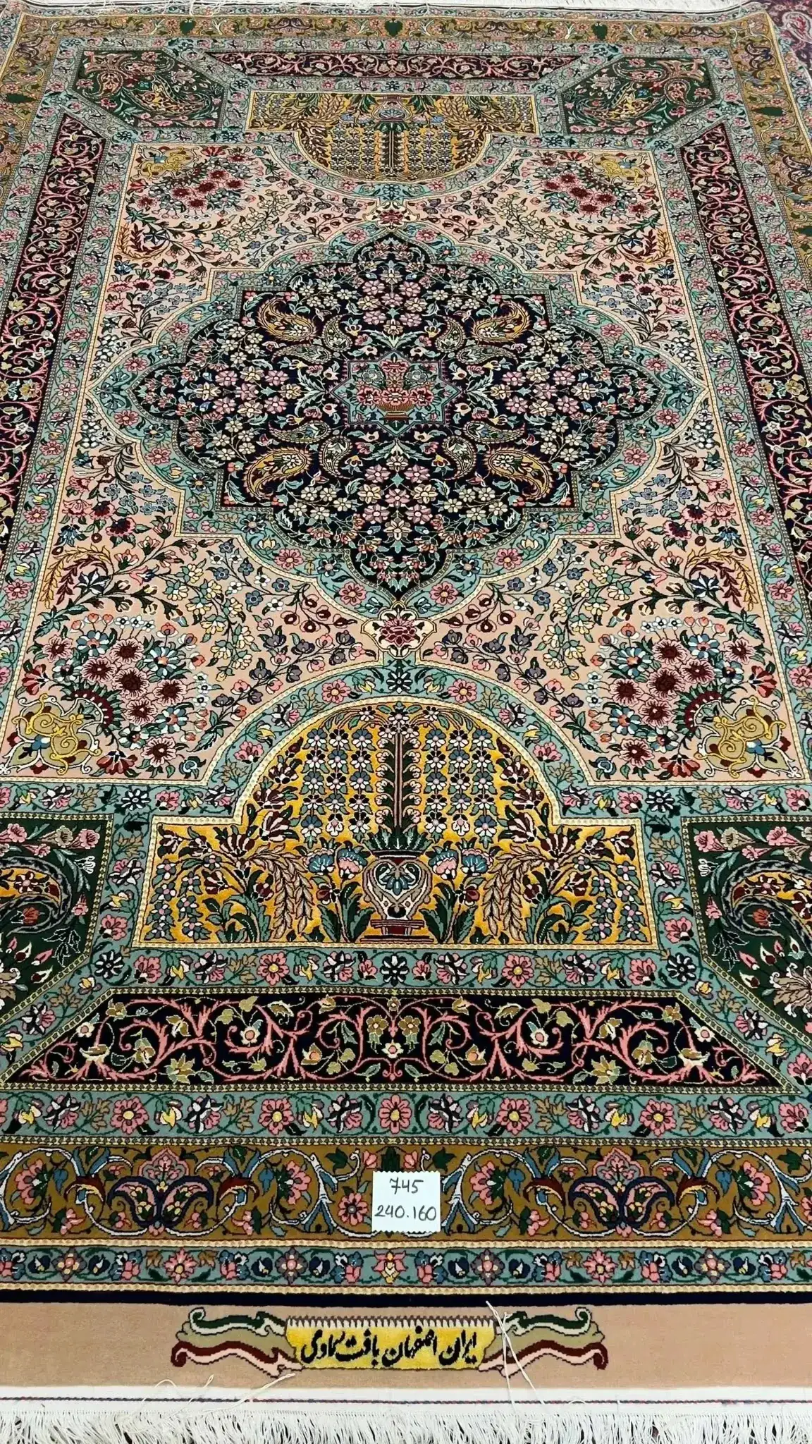 Hand-knotted Samavie Persian Rug – A detailed view of the intricate floral and geometric patterns on a luxurious hand-knotted Persian rug from the Samavie collection, blending silk and wool, showcasing vibrant colors and fine craftsmanship.

