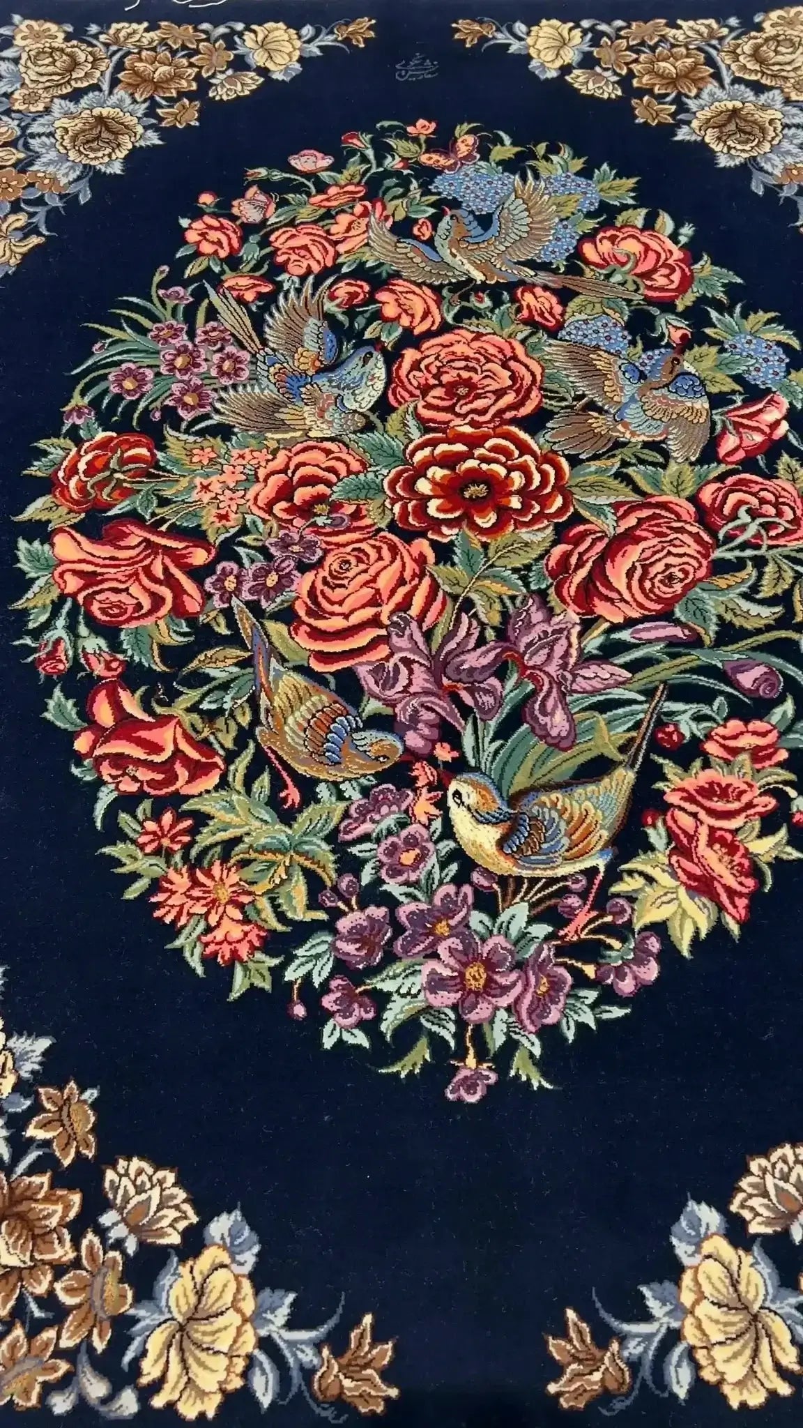 Isfahan navy Persian rug displaying the craftsmanship of floral motifs