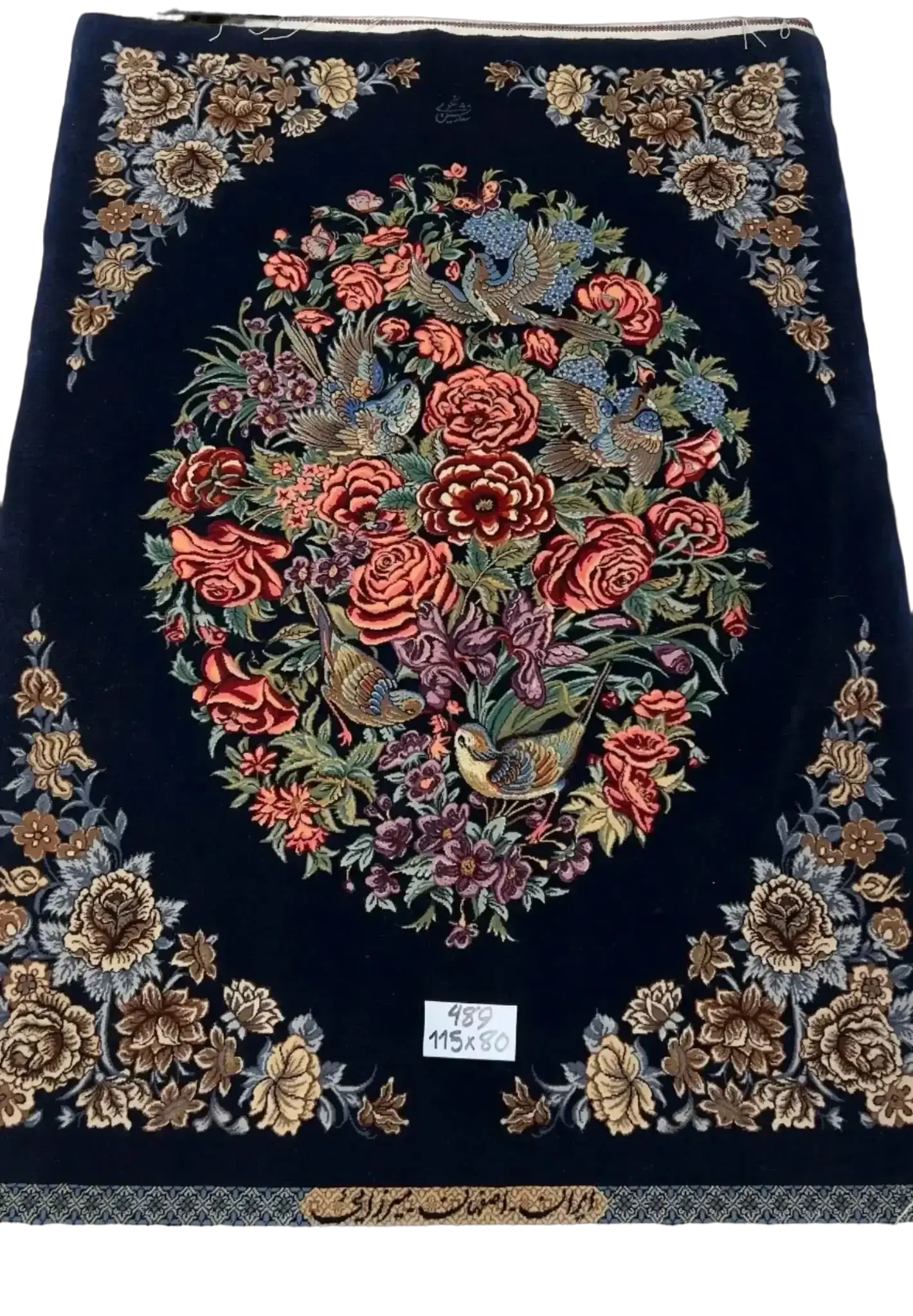 Handcrafted navy Persian rug with intricate floral patterns from Isfahan