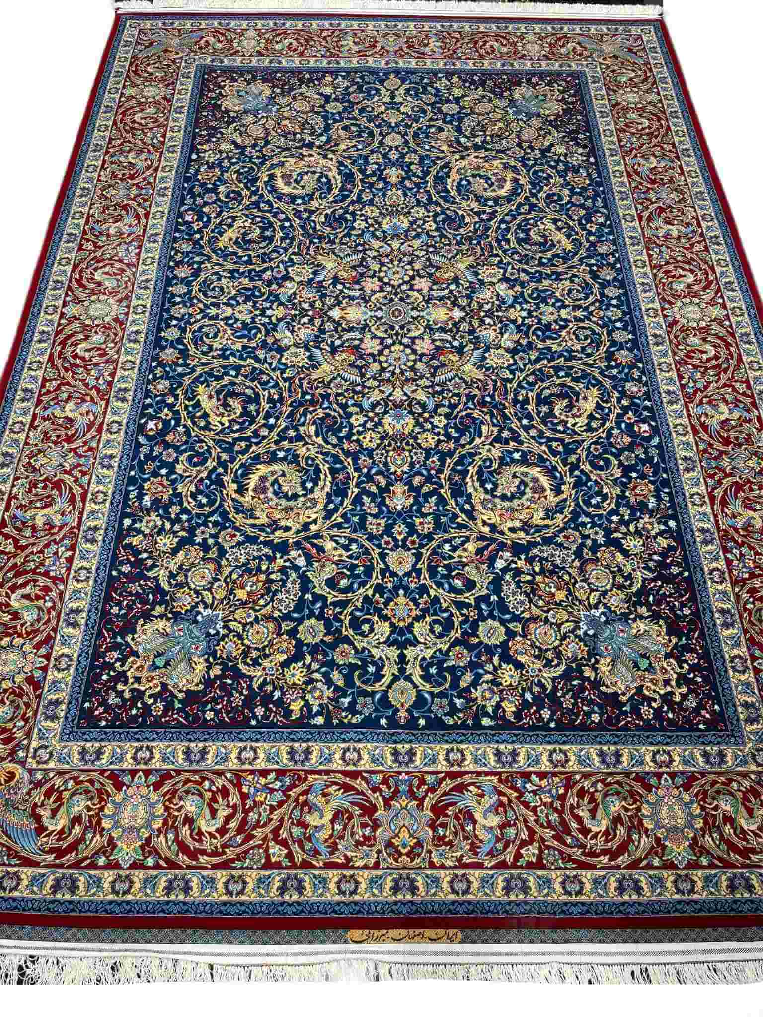 Hand Knotted Persian Rug – A stunning large area rug featuring an intricate Isfahan design, hand-knotted with wool and silk, perfect for elegant interiors.
