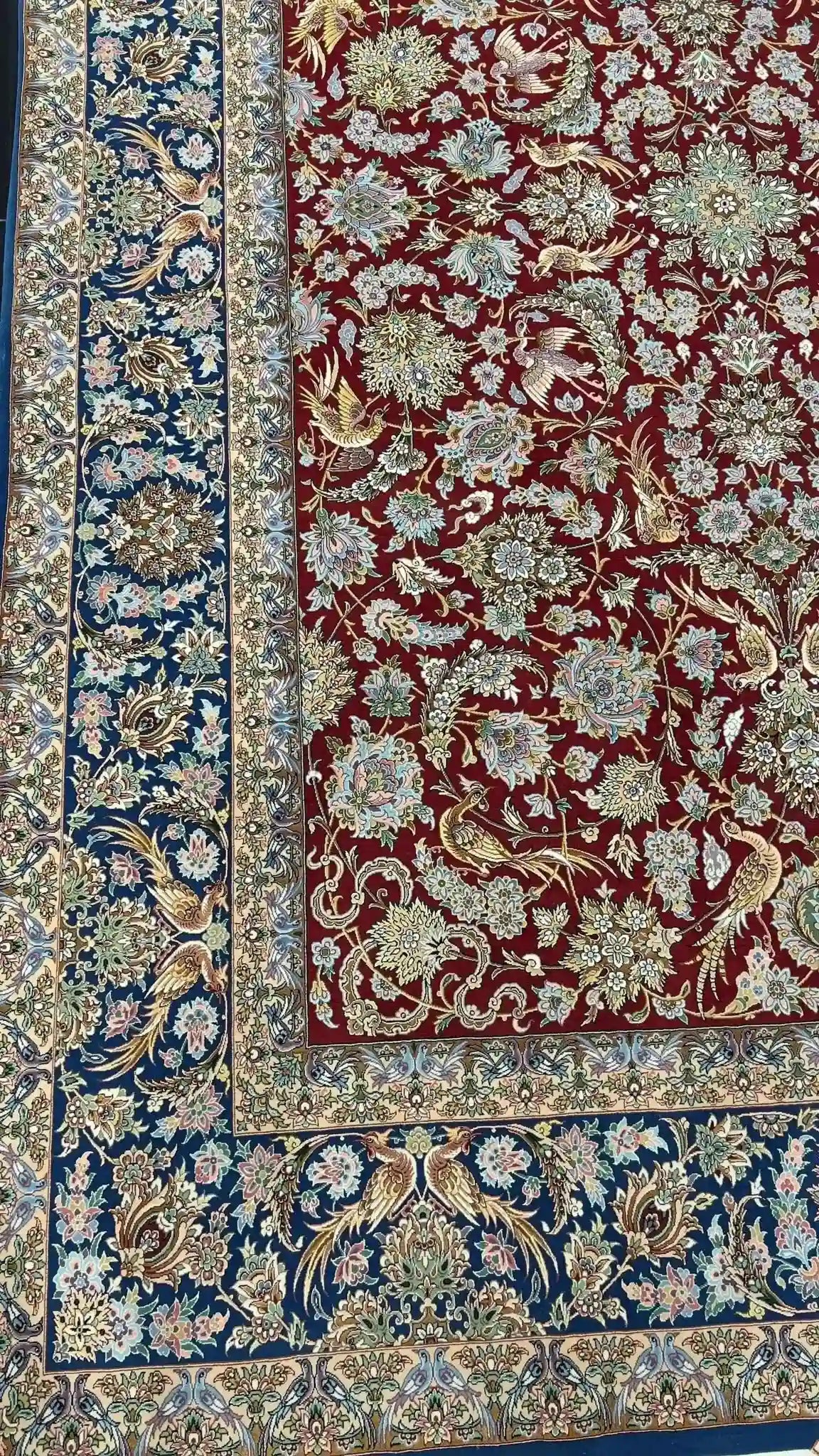 Isfahan handmade Persian rug with silk and wool, red and blue tones
