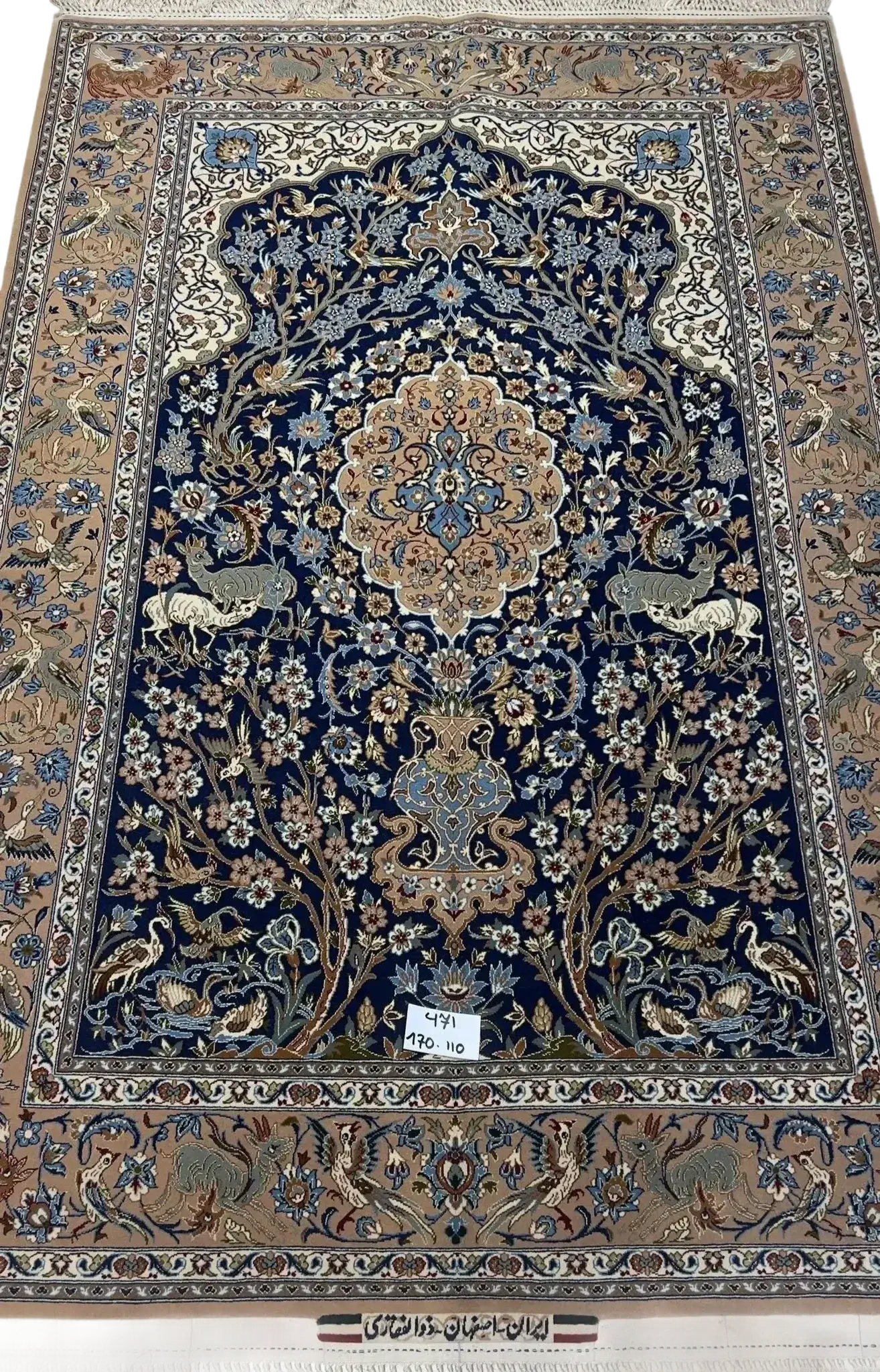 Close-up view of the fine craftsmanship on the Limited Edition Persian Rug with blue and brown motifs