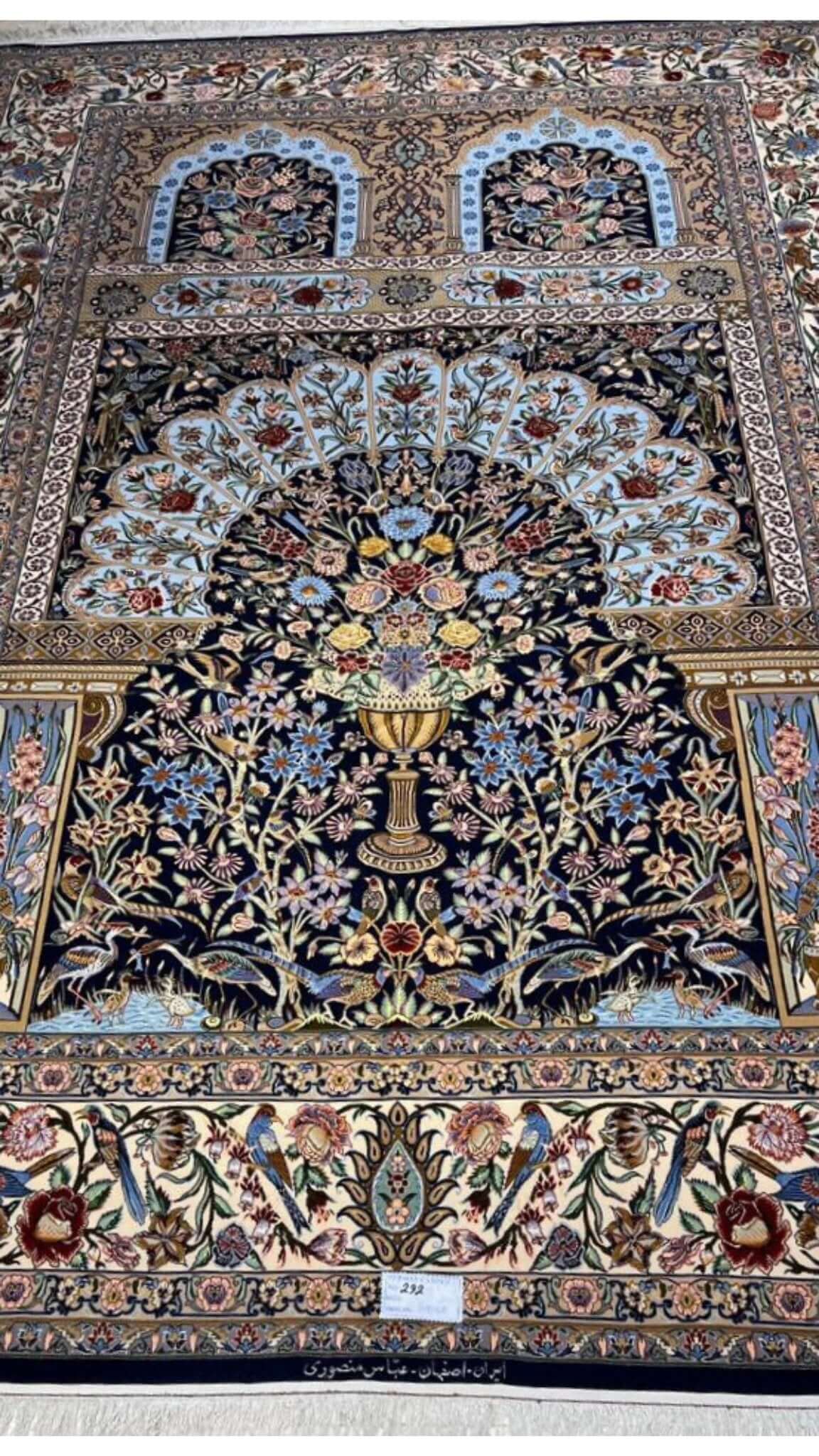 "Luxurious Persian rug featuring intricate motifs and borders"