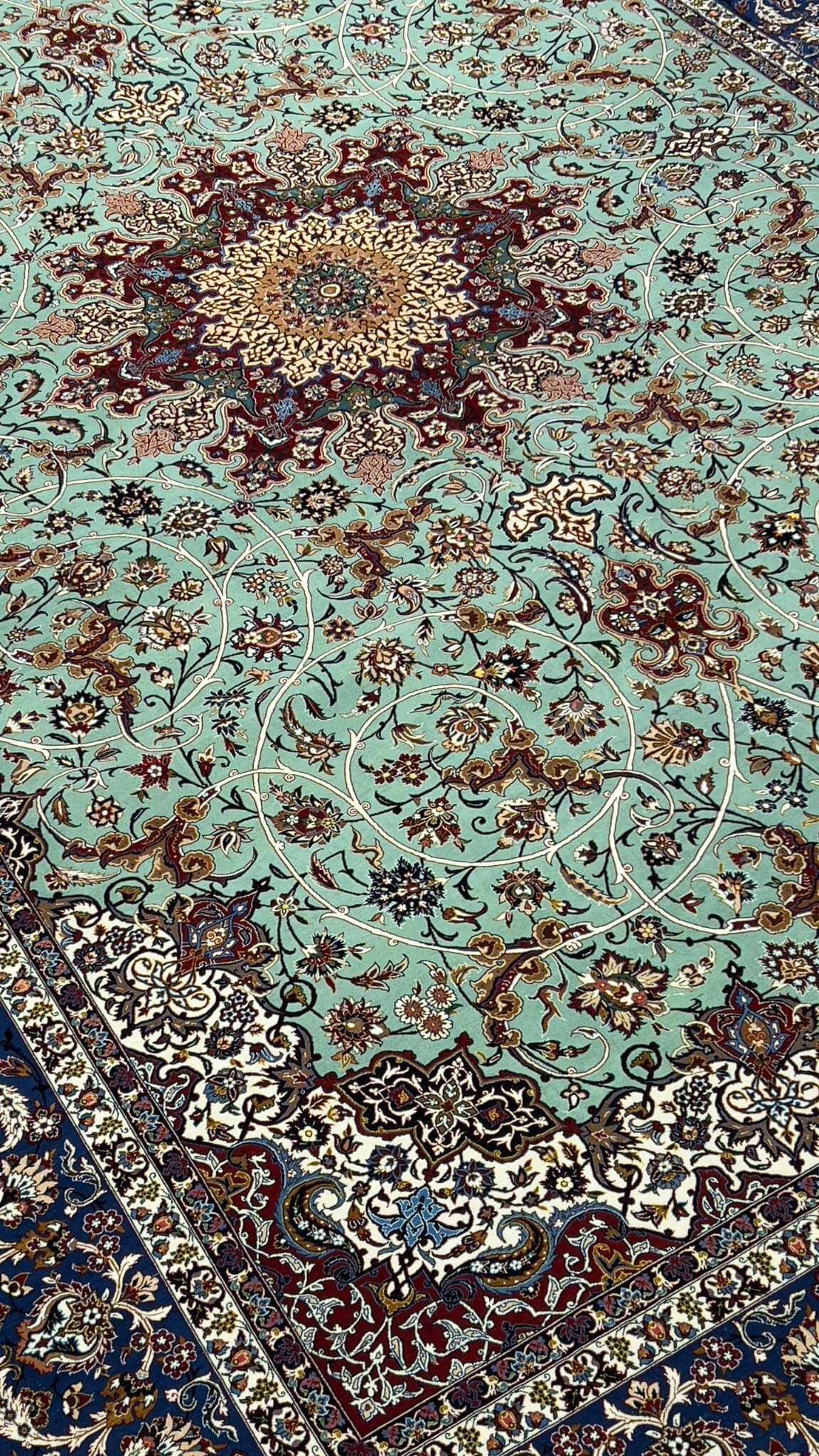 "Close-up of the pure silk and kurk wool blend in Seirafian Isfahan rug with high knot density and floral medallion pattern"