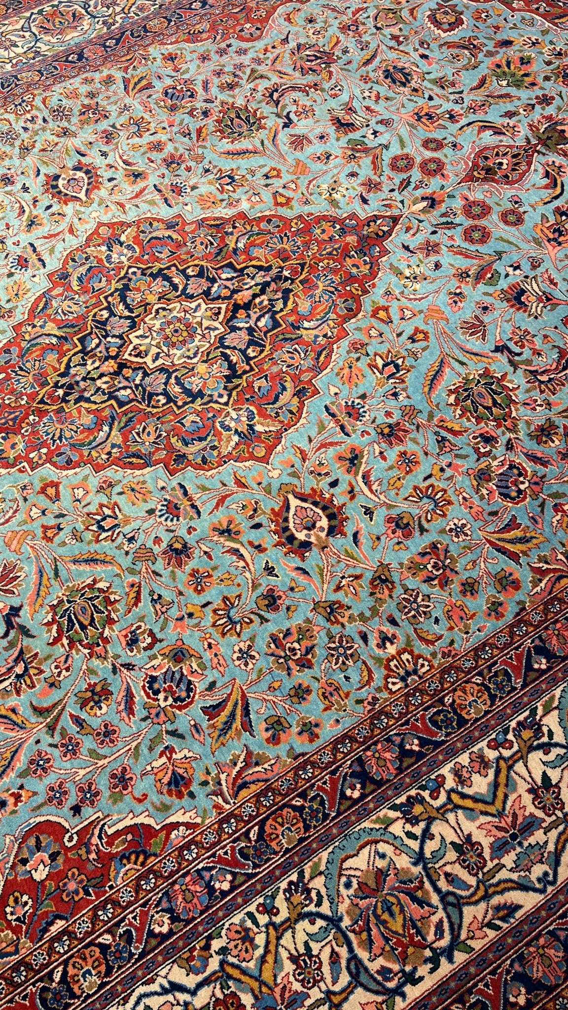 "Close-up of vintage Persian Kashan rug showing floral medallion and high knot density"