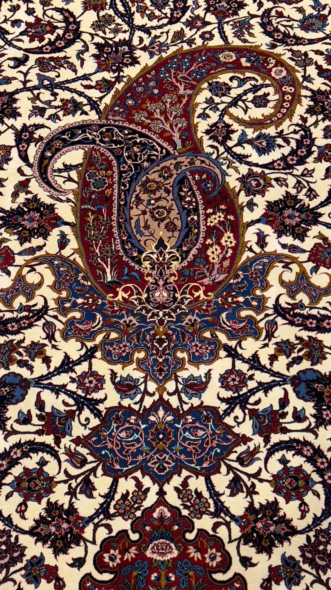 Handwoven Isfahan Persian rug in red, ivory, and blue with natural dyes.