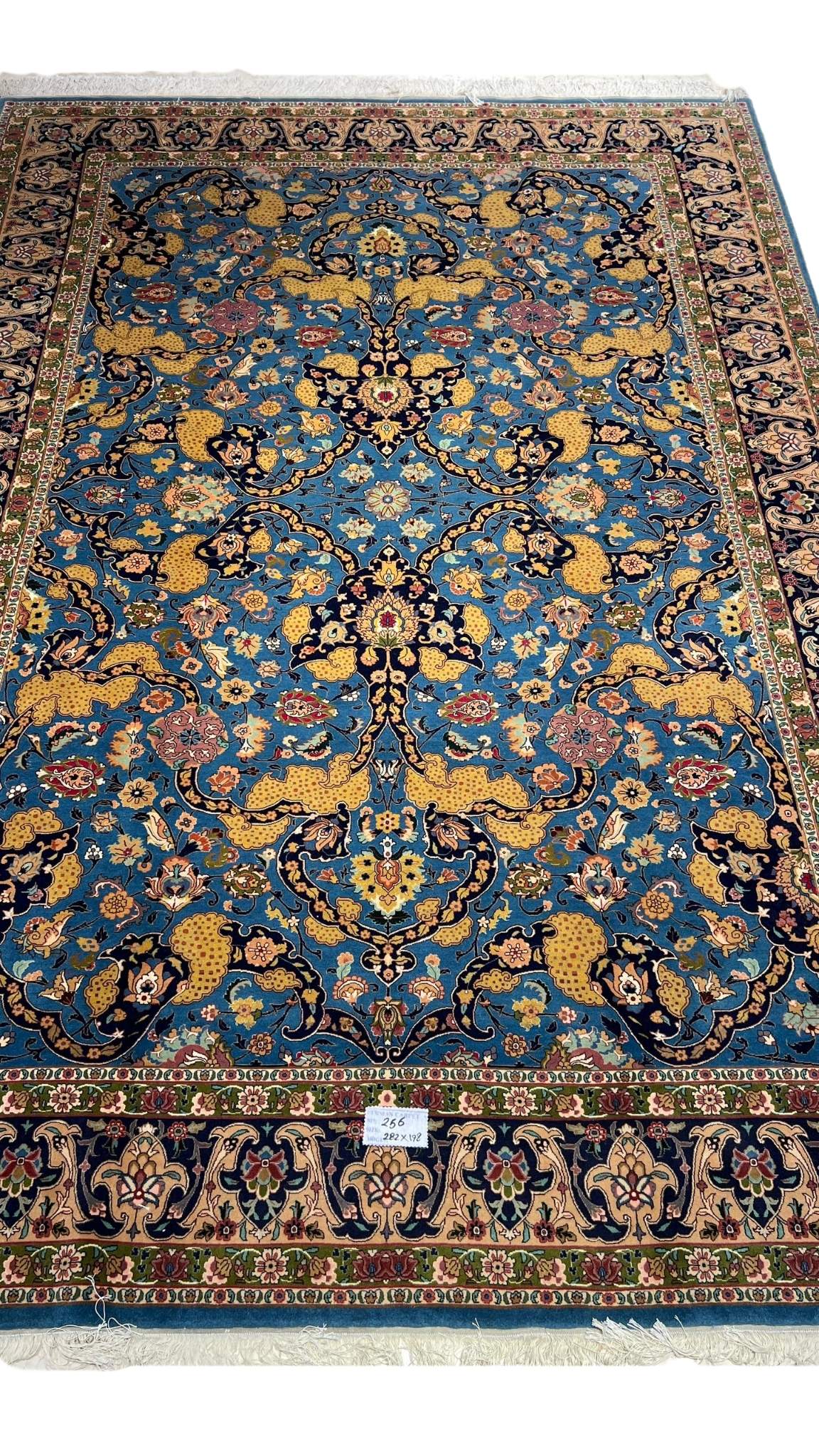 60-year-old antique Tabriz rug with intricate floral design, 282 x 198 cm.