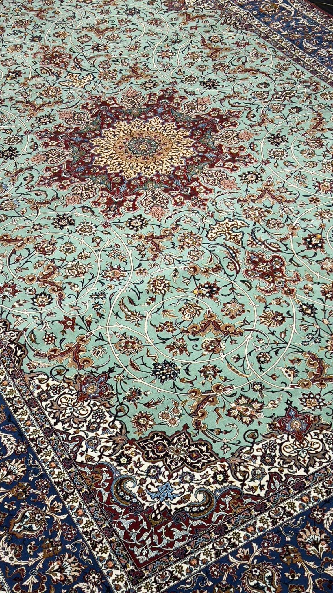 "Close-up of high knot count in Seirafian rug – intricate floral central medallion"