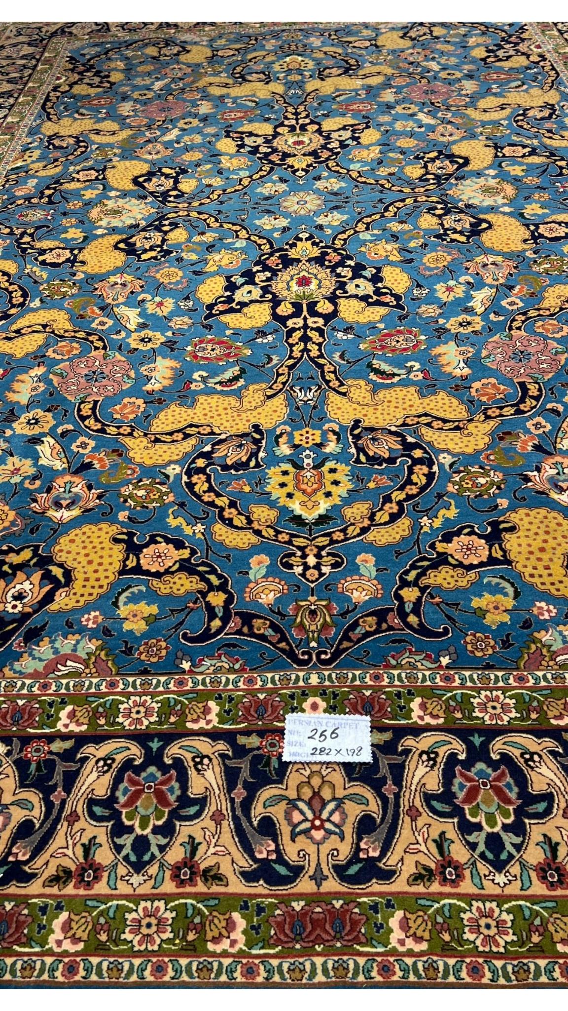 Antique Tabriz rug from Iran, showcasing traditional Persian artistry.