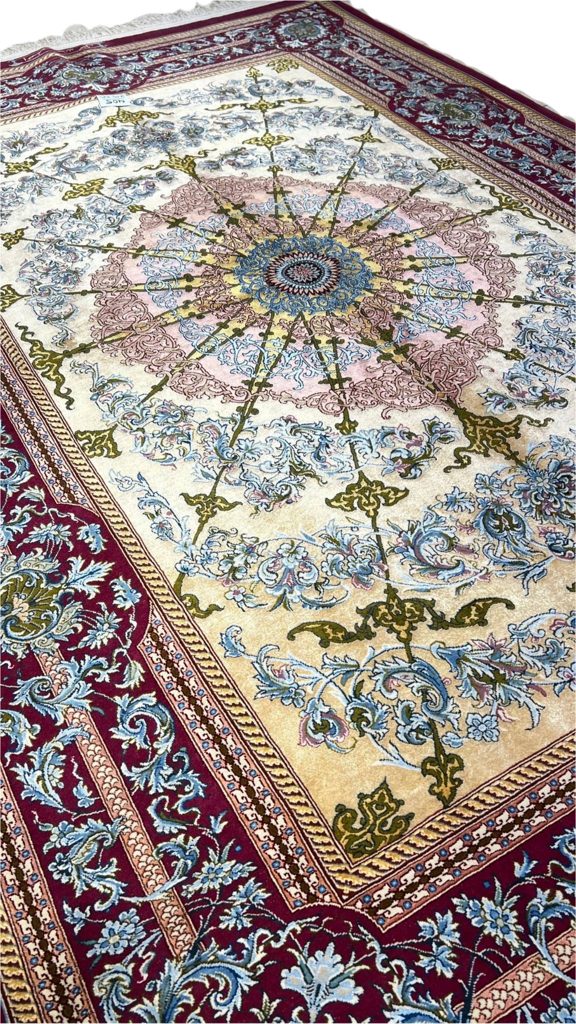 Close-up of floral patterns on Persian silk rug, Isfahan craftsmanship