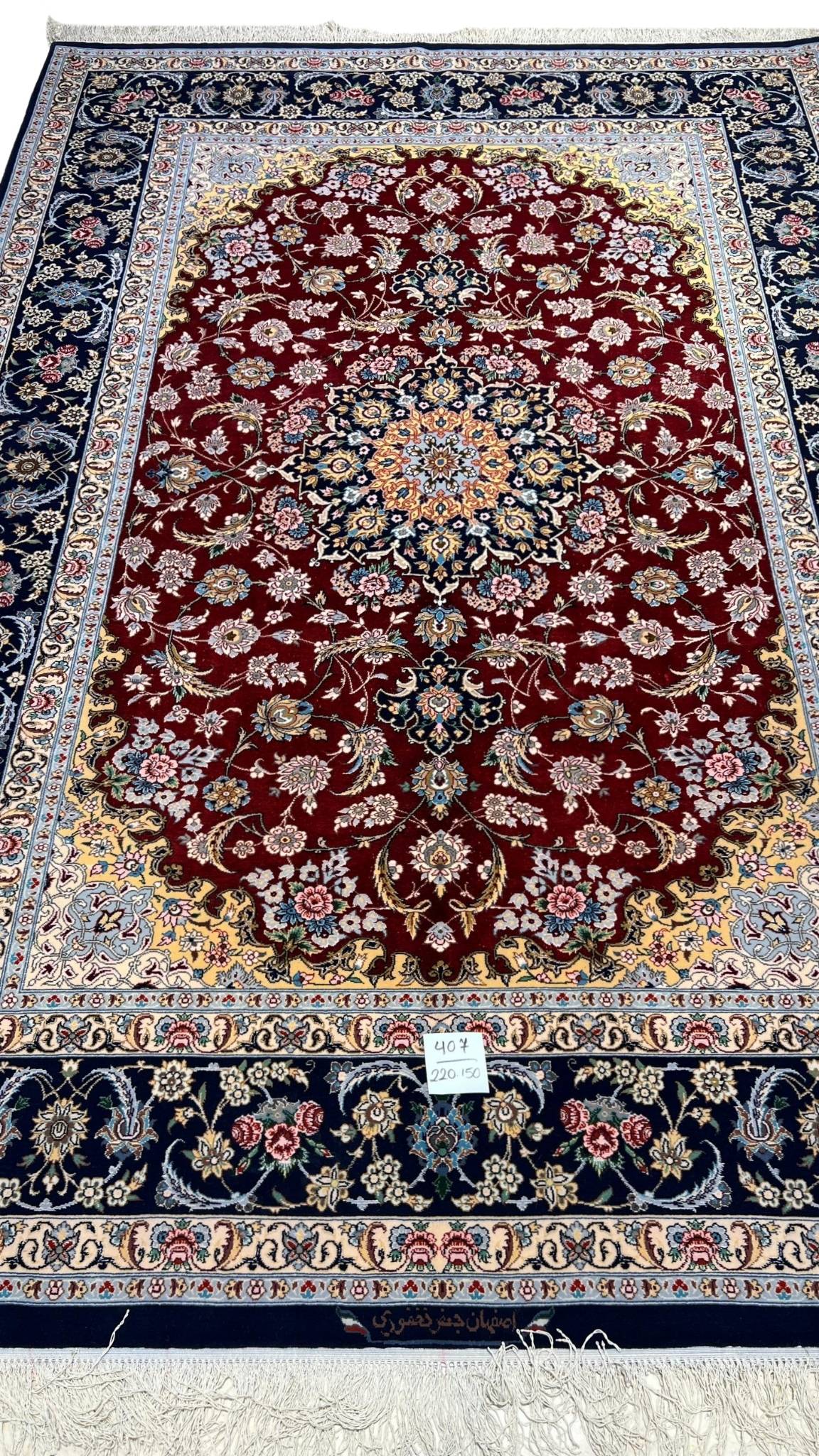  Hand-knotted red and black Persian rug with floral design by Jafar Fakhforie