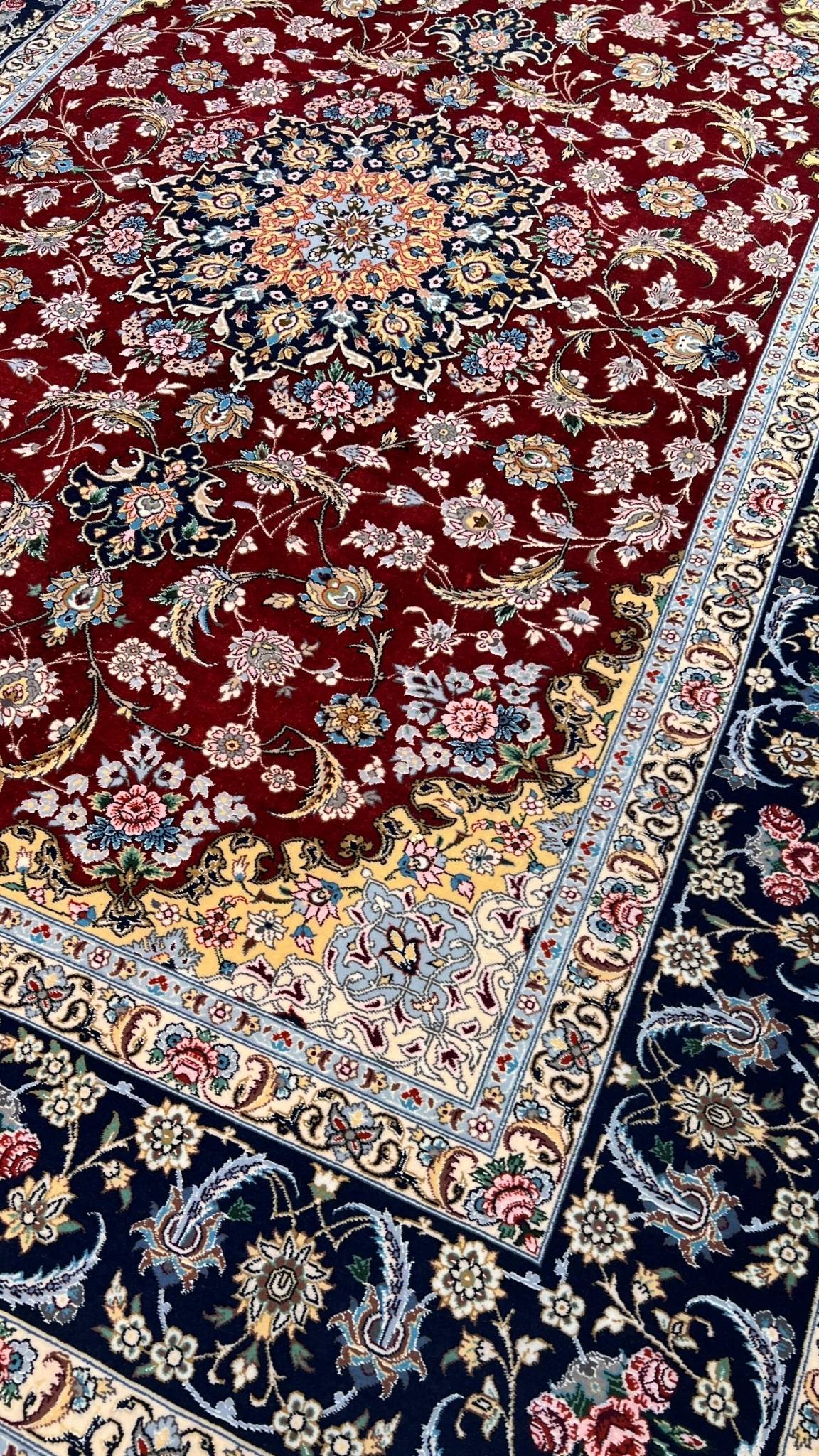 Red and black Persian rug from Isfahan, made of wool and silk