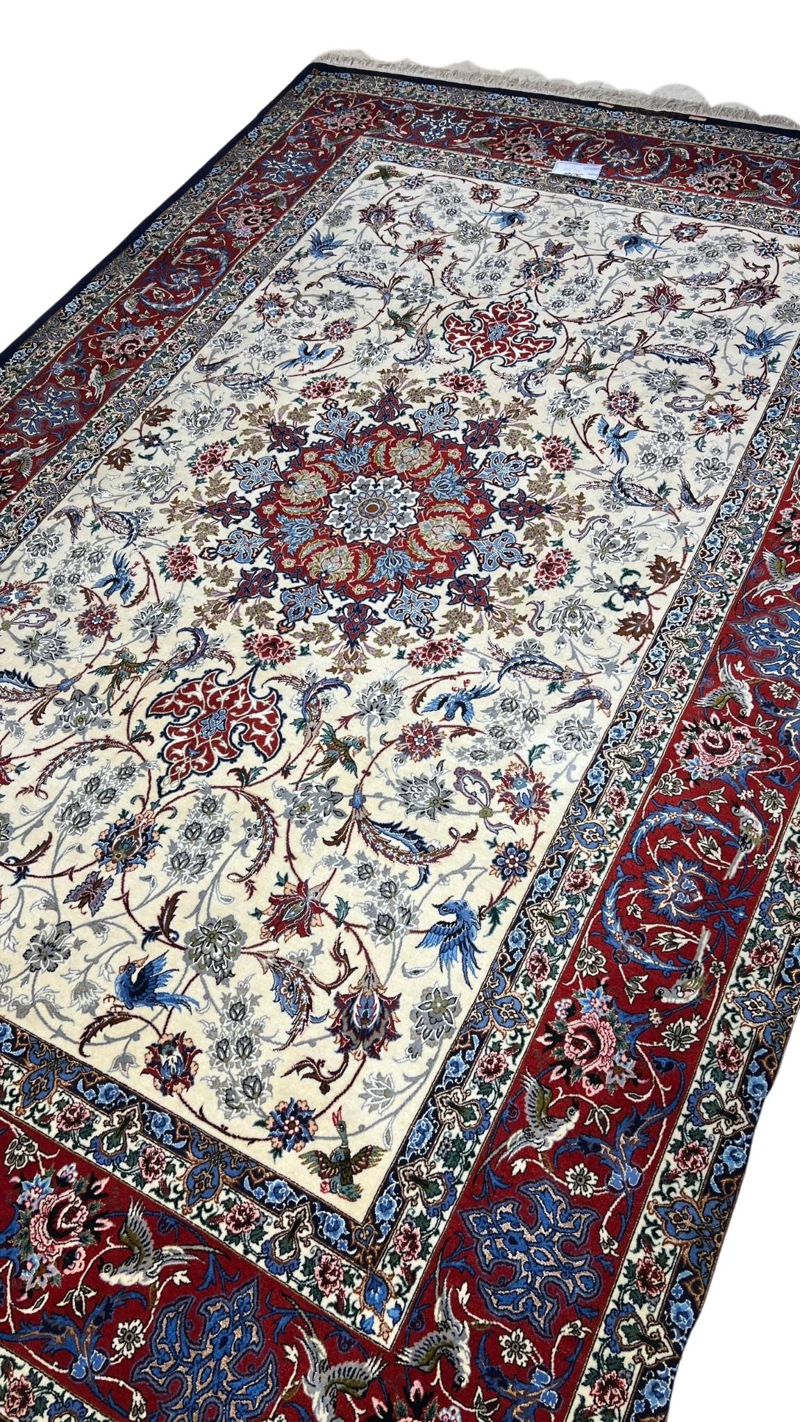 Hand-knotted Persian rug with wool and silk, red and cream colors