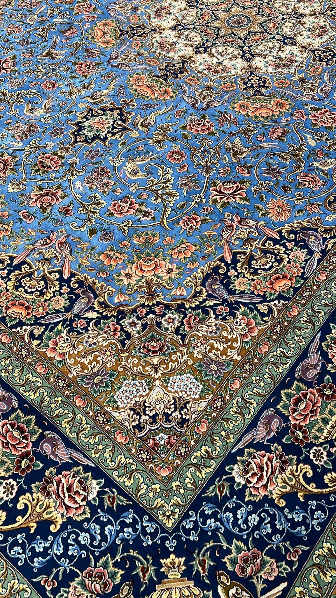 Handcrafted Iranian carpet with blue and floral patterns, 220x150 cm







