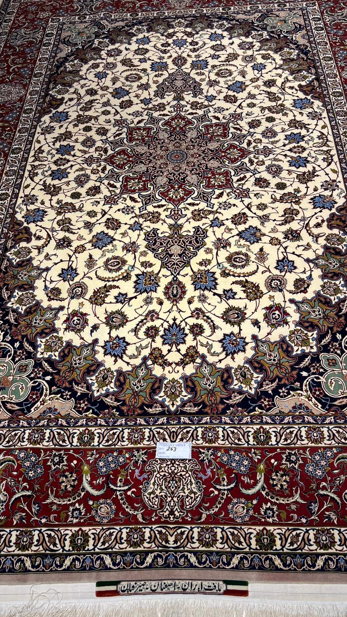 Authentic 8x10 beige and red Persian carpet with floral design
