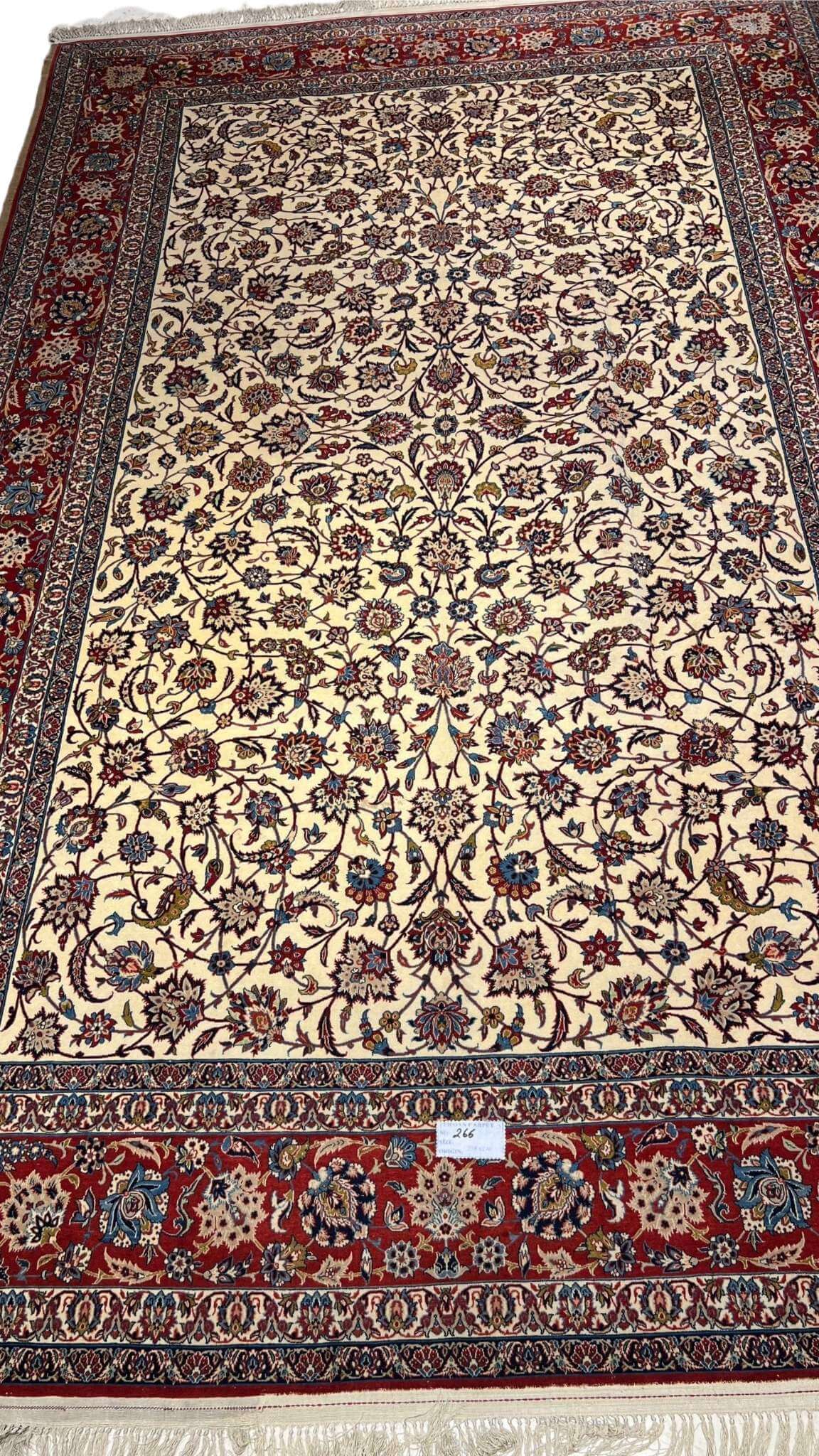 "Vintage Isfahan rug with intricate floral design, hand-knotted in Iran"
