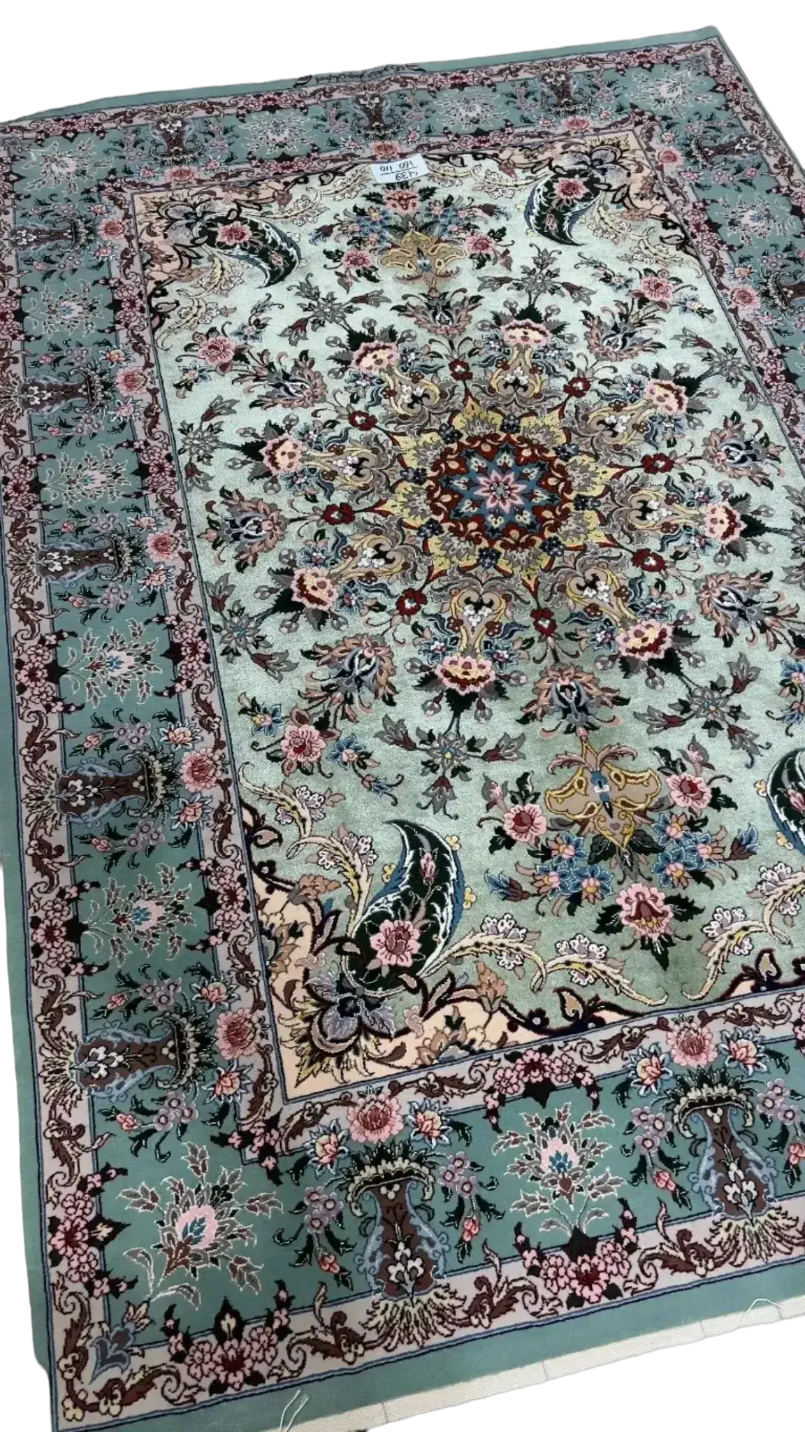 Traditional Isfahan carpet with elaborate floral patterns