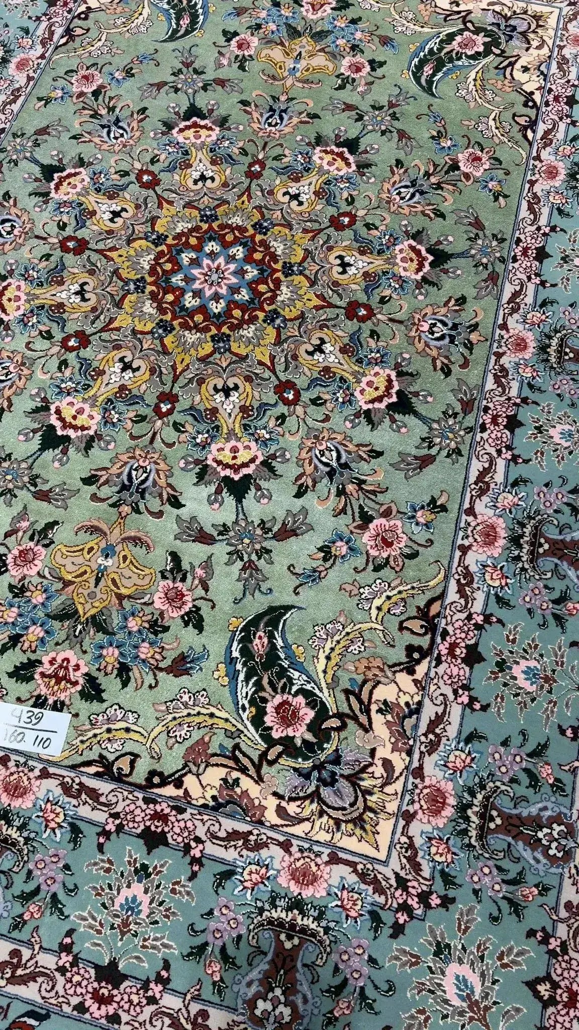 Handwoven Isfahan rug adorned with detailed floral designs