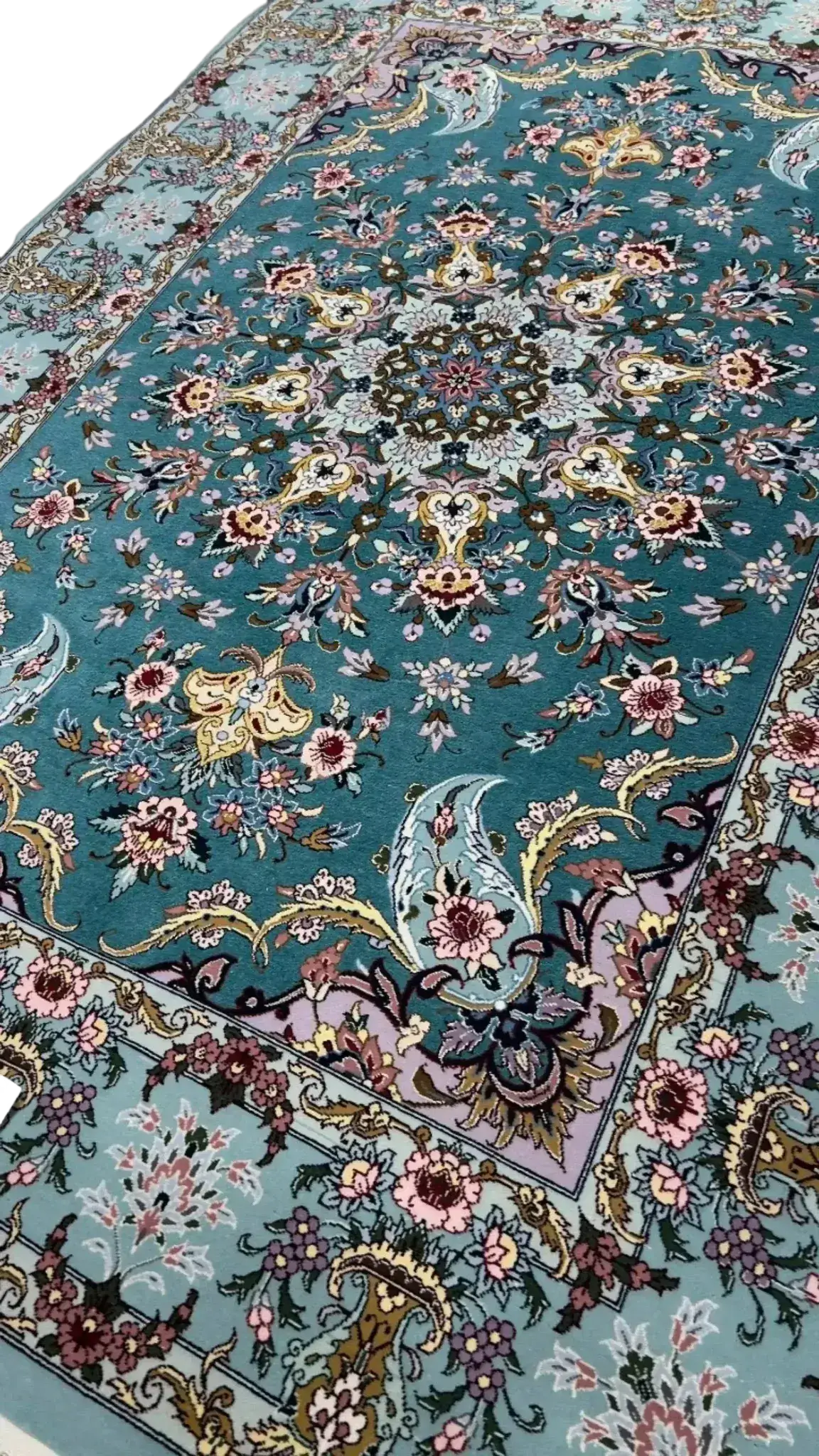 Isfahan's heritage rug in shades of blue and purple with floral artistry