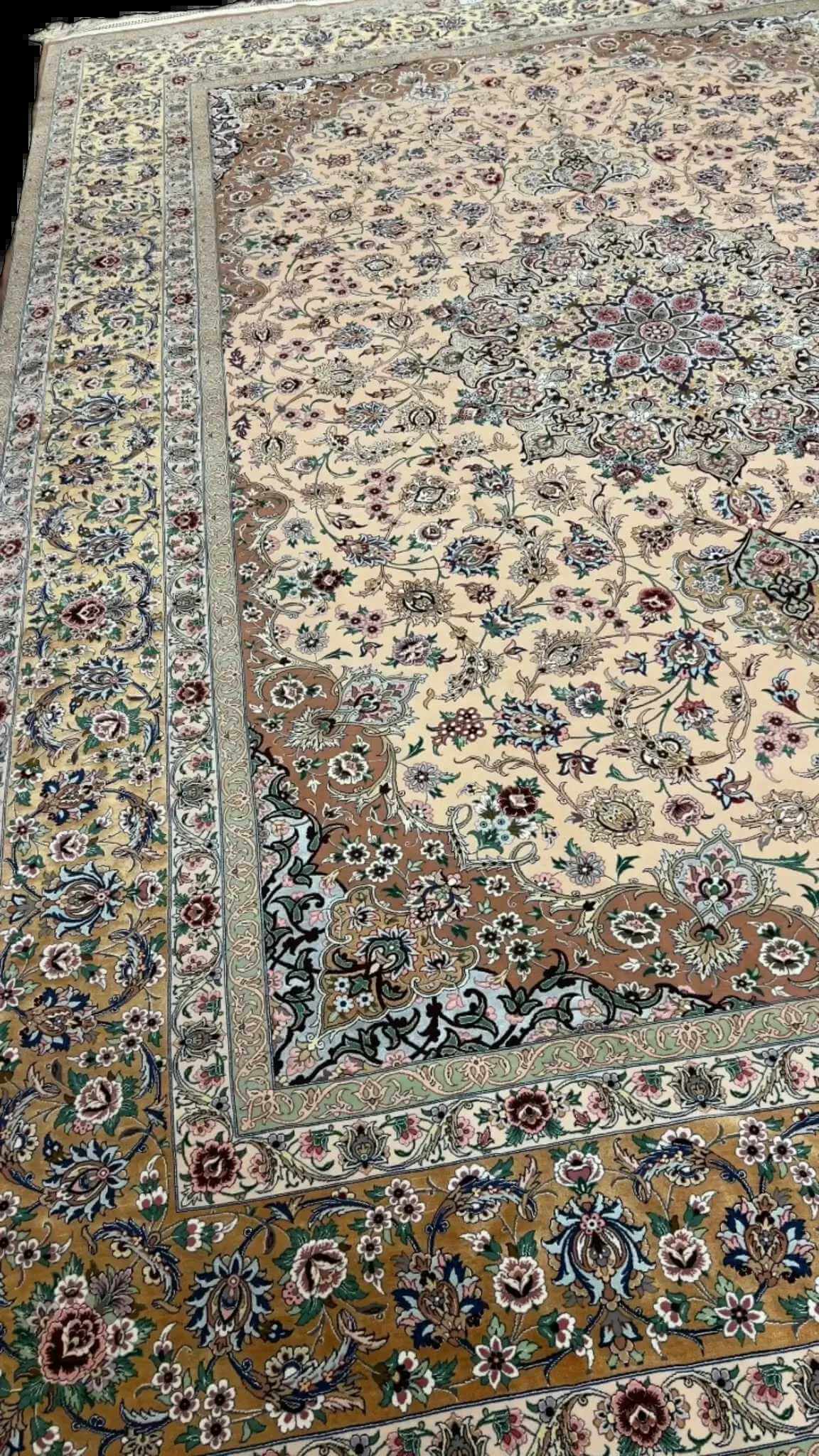 Beige hand-knotted Iranian rug with intricate floral patterns