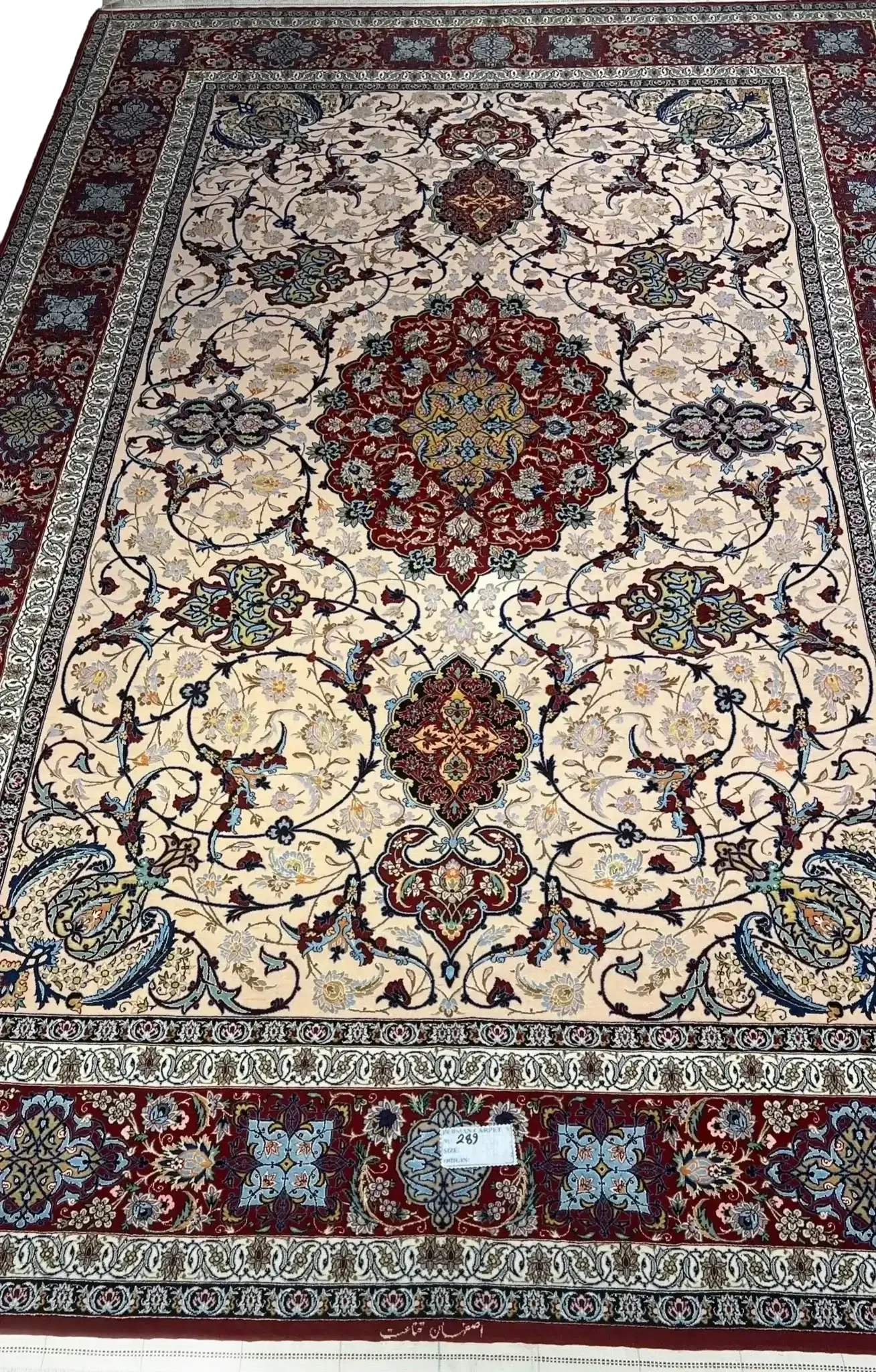 Handcrafted Ghenaat Isfahan rug with intricate floral patterns