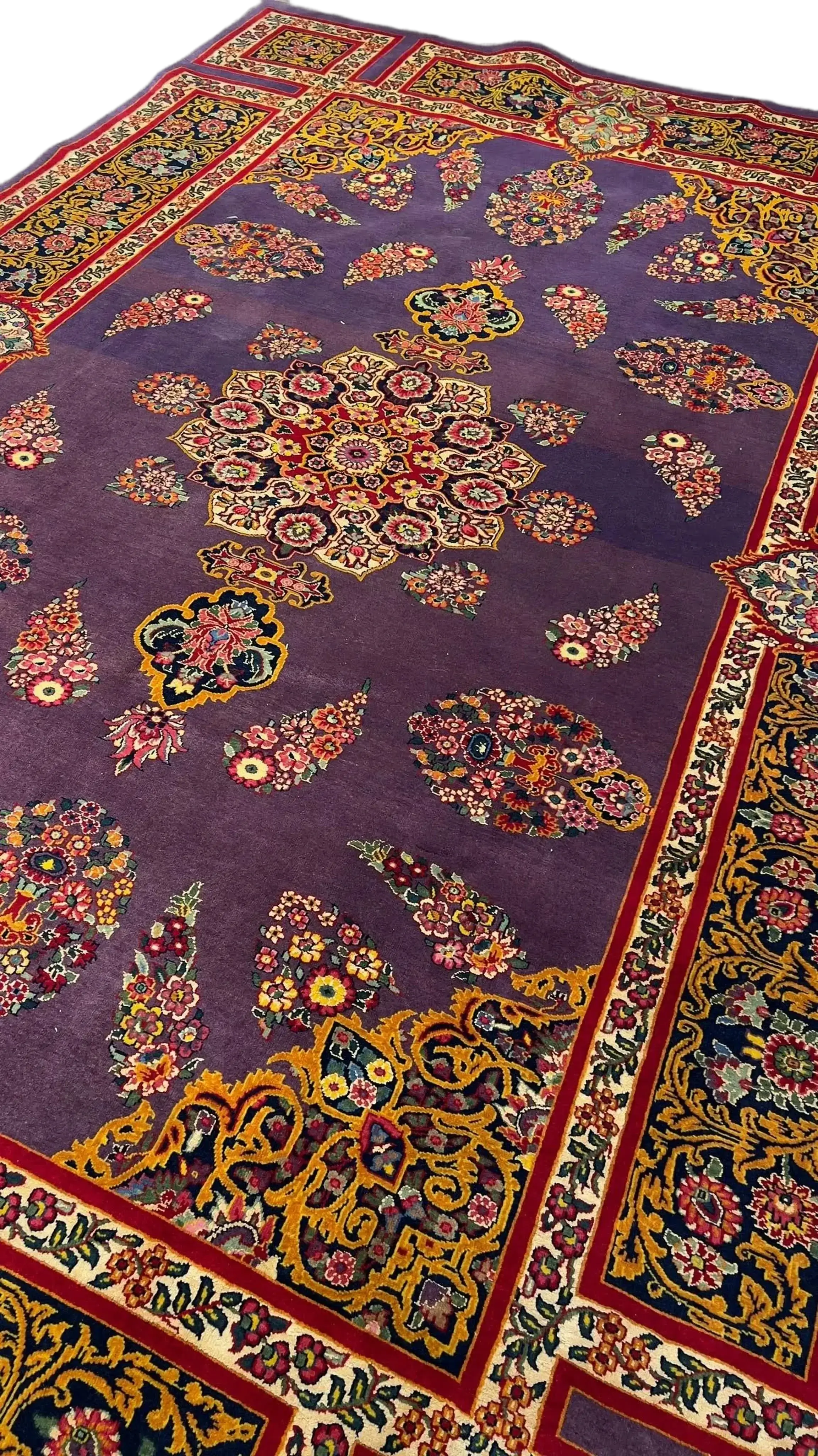 The Elegant Mashad Rug displayed in a room setting to give an idea of its size and design