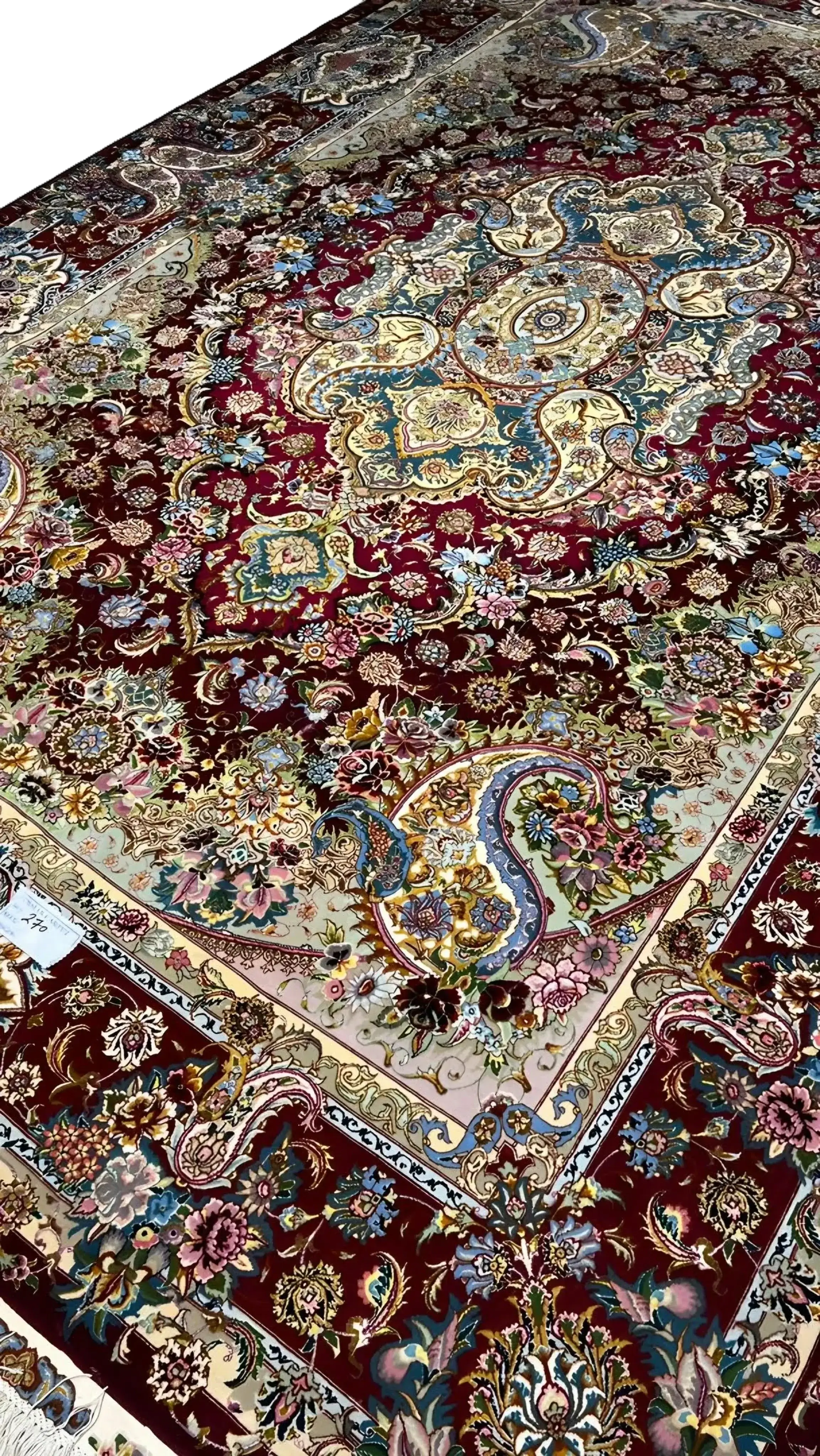 Handcrafted Tabriz rug with intricate medallion pattern for home decor