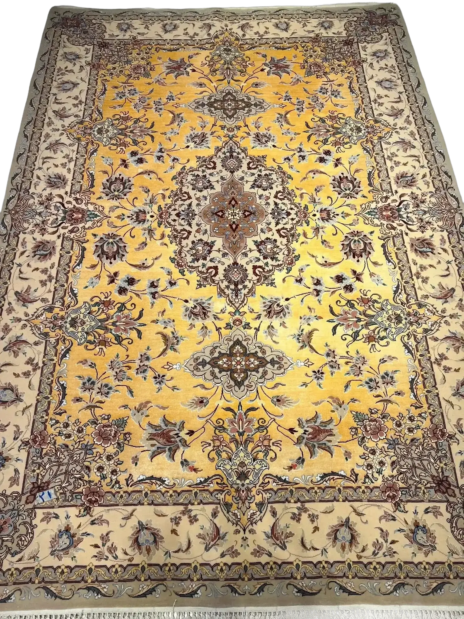 Spacious oriental-inspired silk rug in shades of gold and beige