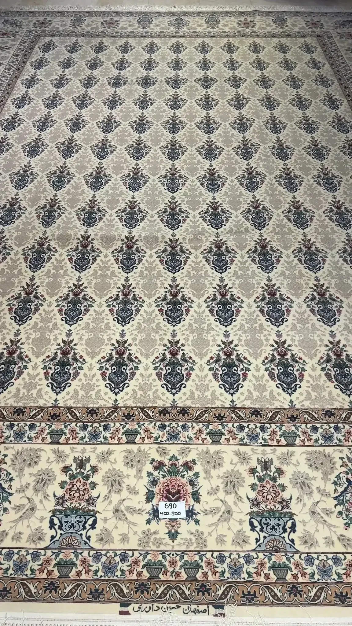 "Exquisite Hand-Knotted Persian Rug from Isfahan, Elegant Silk and Wool Blend" – Highlighting the luxurious materials and origin.
