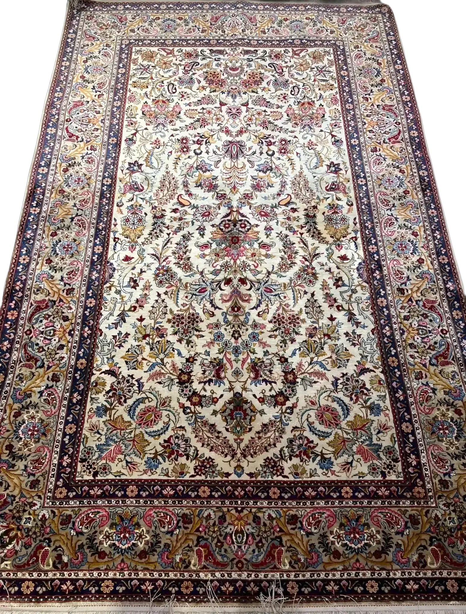 The entire spread of the semi antique full silk Kashan rug showcasing its timeless design