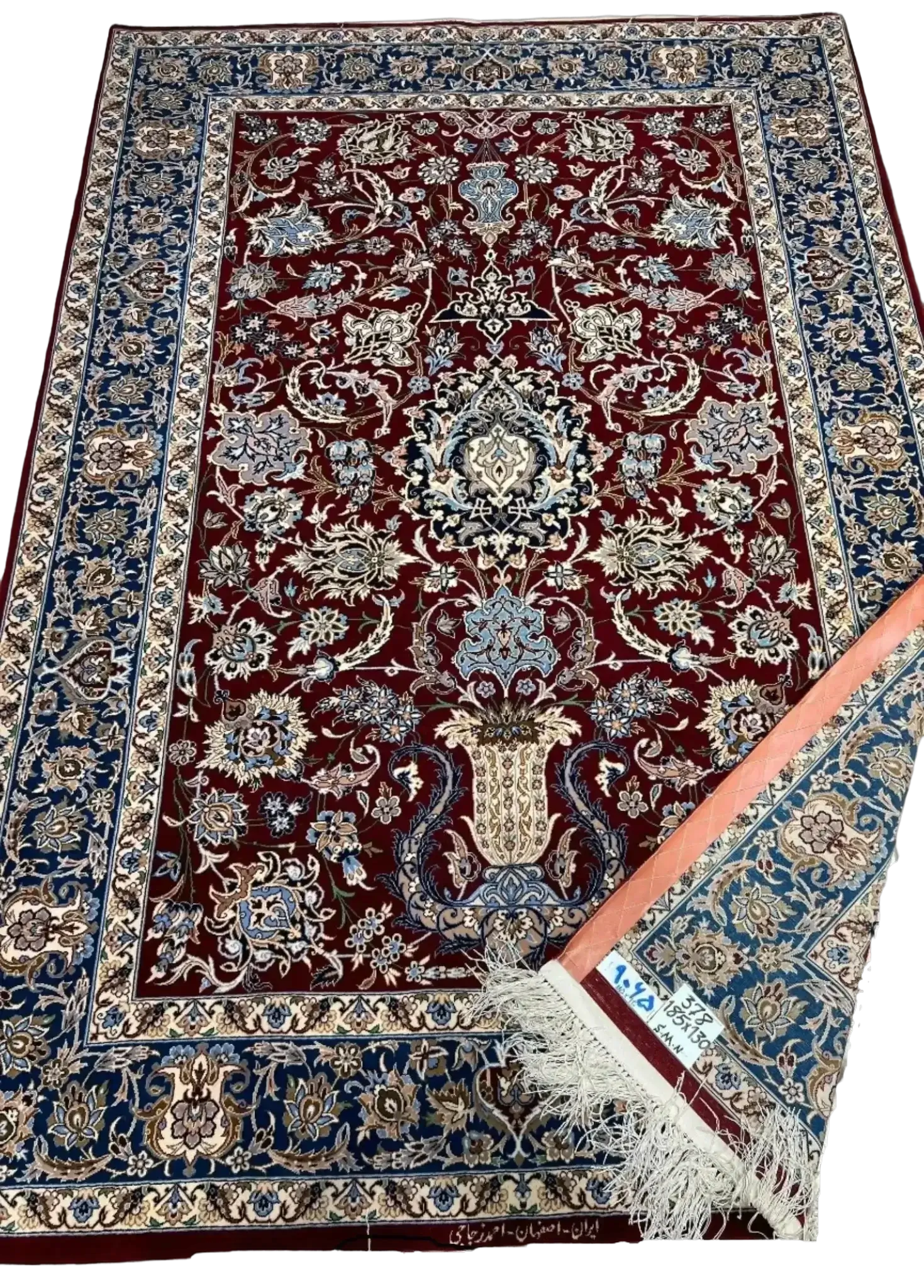 Premium dark red Persian rug with detailed floral artwork on display