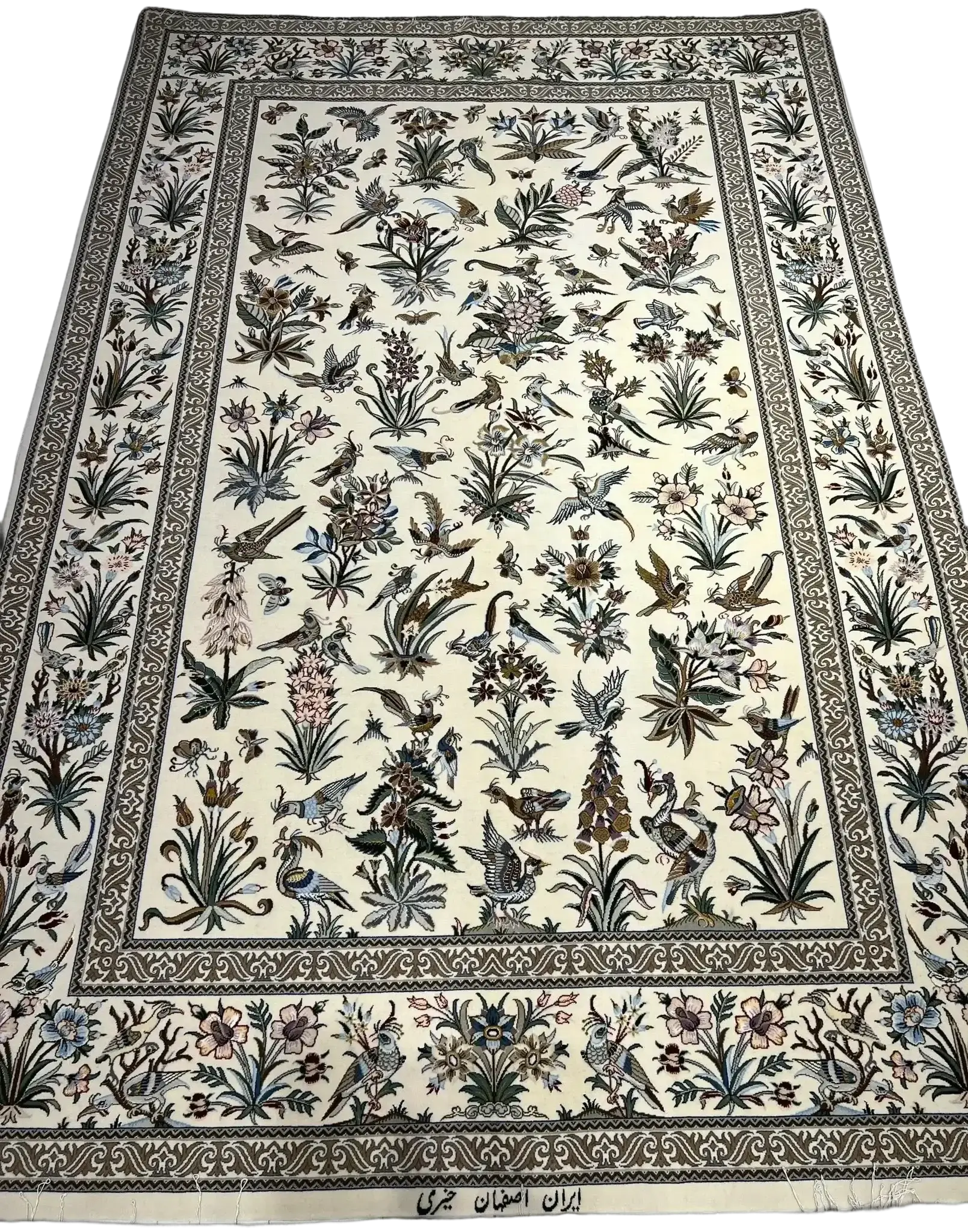 Close-up of the detailed floral craftsmanship on Kheirie's hand-knotted rug