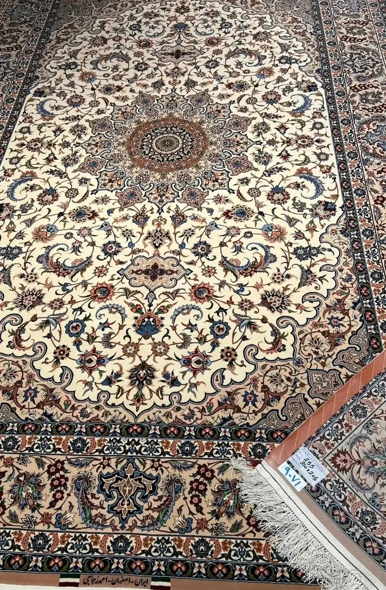 "Luxurious Persian rug from Isfahan, Iran, hand-knotted by Ahmad Zojaji. This large 300 cm x 200 cm (9.8 feet x 6.5 feet) rug features a high knot density of 810,000 knots per square meter and is crafted with a wool and silk pile. The silk warp and traditional design make this new rug a true statement piece."